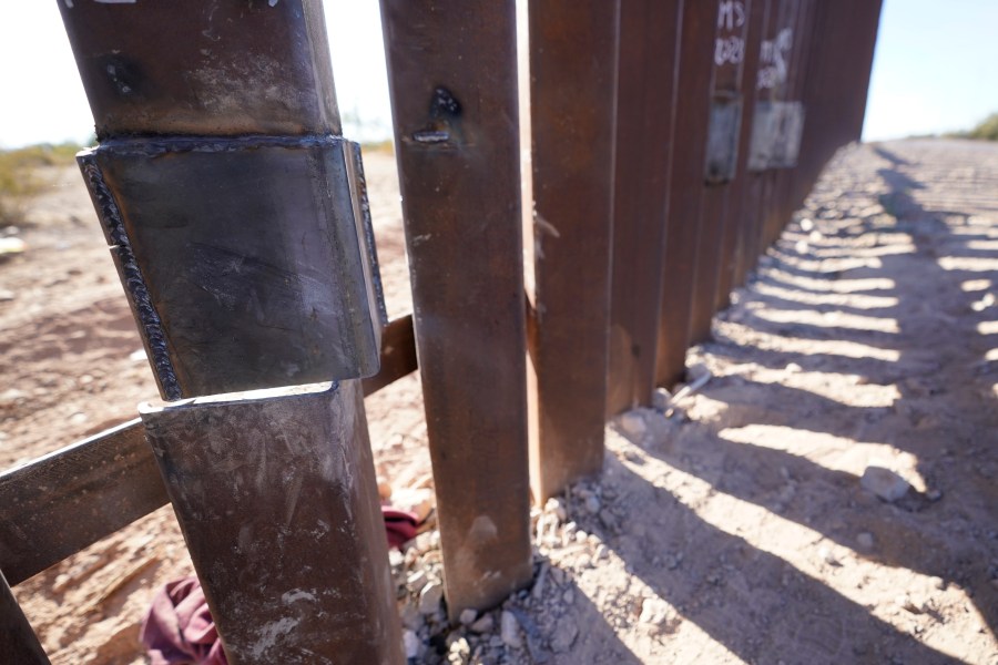 One of the steel columns of the border wall separating Arizona and Mexico is cut directly below a recent repair Friday, Dec. 15, 2023, near Lukeville, Ariz. (AP Photo/Gregory Bull)