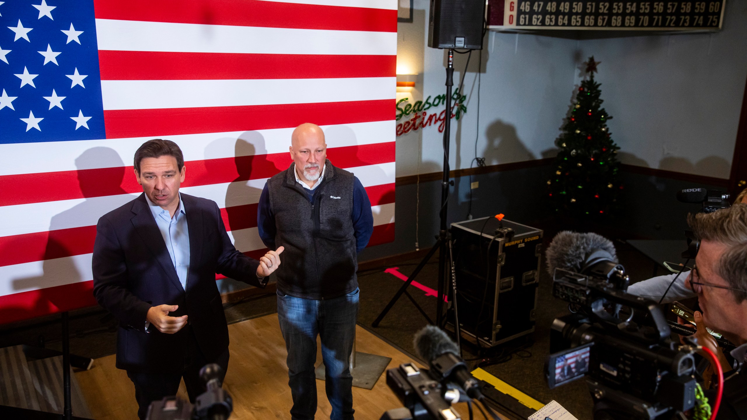 Florida Gov. Ron DeSantis and Rep. Chip Roy, R-Texas, speak with the press during a meet and greet event at VFW Post 788 in Cedar Rapids, Iowa on Tuesday, Dec. 19, 2023. Florida Gov. Ron DeSantis and Rep. Chip Roy, R-Texas, spoke to community members and held a question and answer session. (Nick Rohlman/The Gazette via AP)