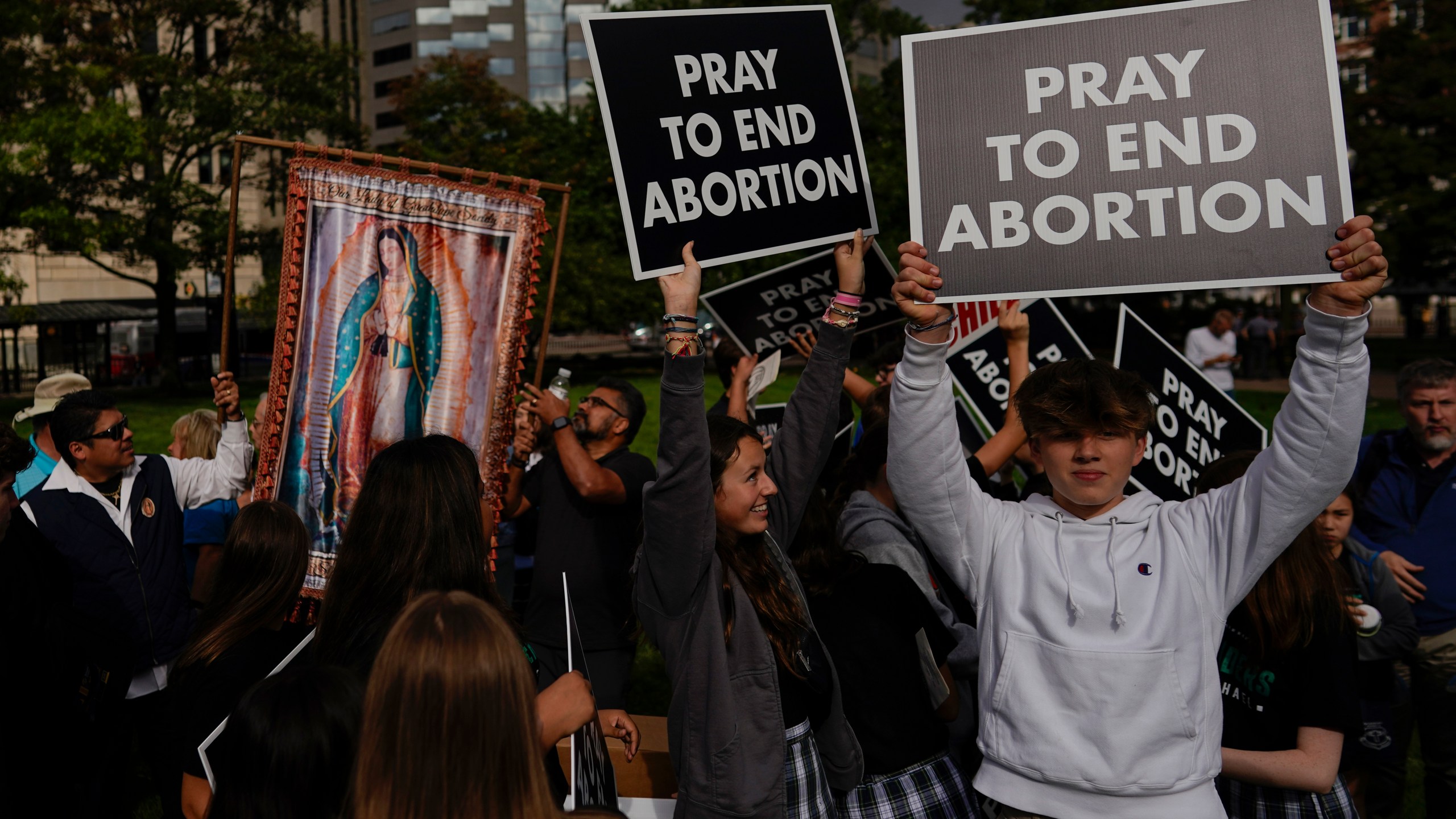 FILE - A group from St. Michael the Archangel School in Findlay, Ohio, gathers during the Ohio March for Life rally at the Ohio State House in Columbus, Ohio, Oct. 6, 2023. Abortion is expected to be a major issue in 2024 for voters, courts and state lawmakers. (AP Photo/Carolyn Kaster, file)