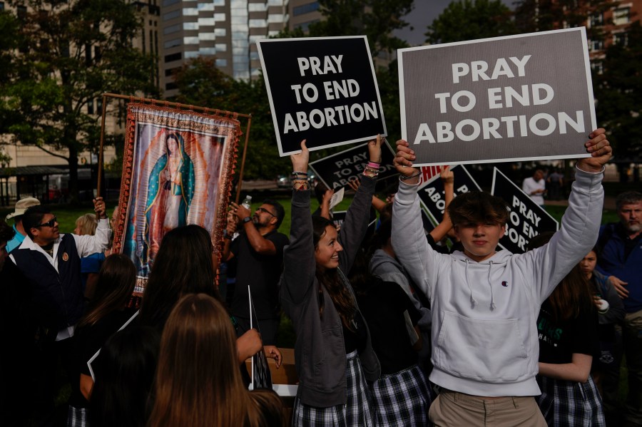 FILE - A group from St. Michael the Archangel School in Findlay, Ohio, gathers during the Ohio March for Life rally at the Ohio State House in Columbus, Ohio, Oct. 6, 2023. Abortion is expected to be a major issue in 2024 for voters, courts and state lawmakers. (AP Photo/Carolyn Kaster, file)