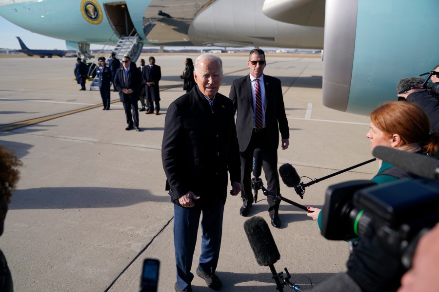 President Joe Biden speaks to members of the media as he arrives at Milwaukee Mitchell International Airport, Wednesday, Dec. 20, 2023, in Milwaukee. (AP Photo/Evan Vucci)