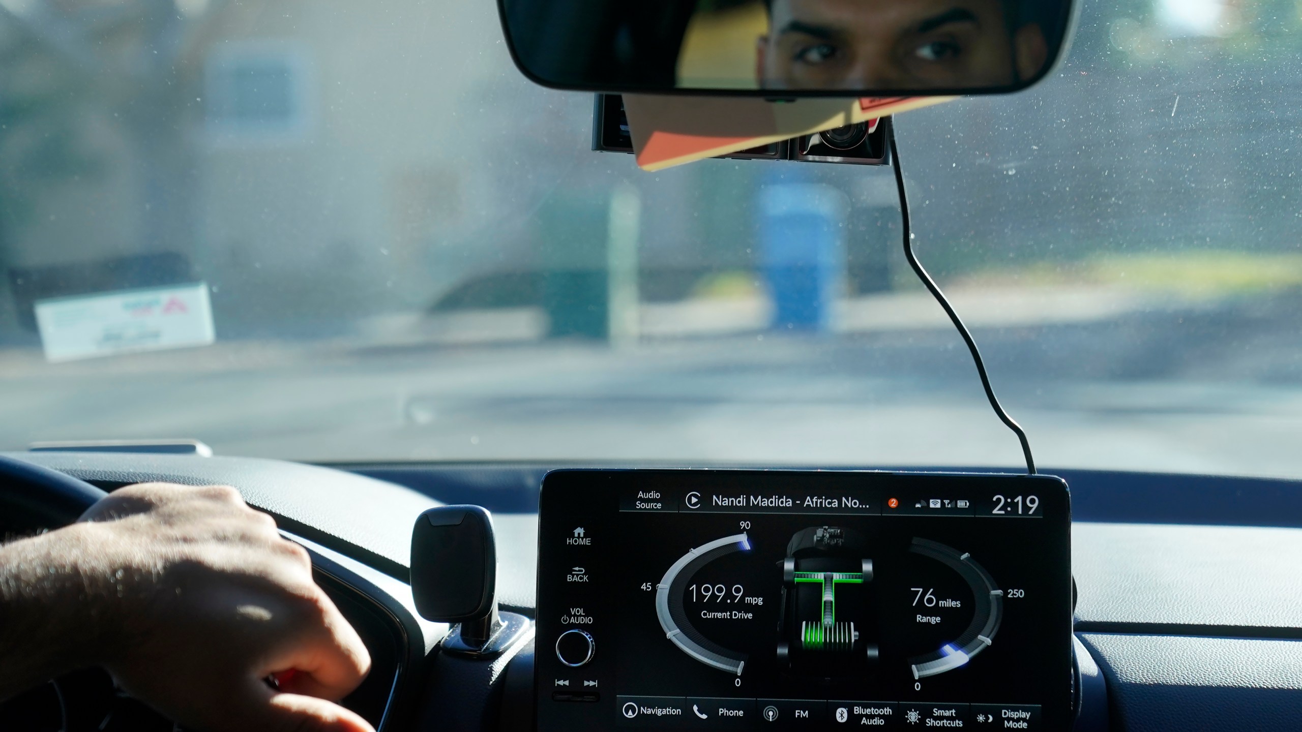 Power Flow information is displayed on the screen of a 2024 Honda CR-V Hybrid as Shalinder Singh drives while being interviewed in Sunnyvale, Calif., Monday, Dec. 11, 2023. Like many hybrid buyers, Singh, an Uber driver, said that for him, the gas savings helped tip the price equation in favor of a Honda CR-V hybrid over the corresponding gasoline model. (AP Photo/Jeff Chiu)