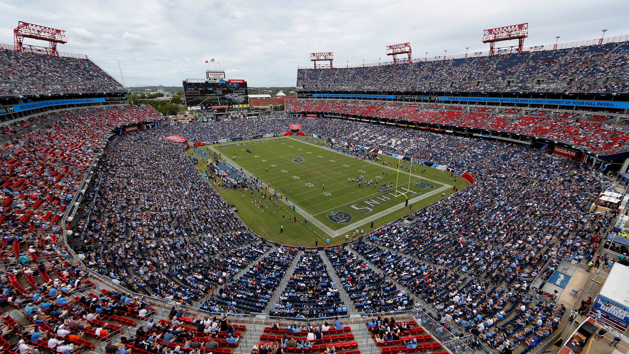 FILE - The Tennessee Titans play an NFL football game against the Houston Texans at Nissan Stadium in Nashville, Tenn., Sept. 16, 2018. Proposals for new and improved sports stadiums are proliferating across the U.S. — and could come with a hefty price tag for taxpayers. The Titans new $2.1 billion domed stadium includes $760 million in local bonds the Nashville City Council approved to go with $500 million in state bonds.(AP Photo/James Kenney, File)