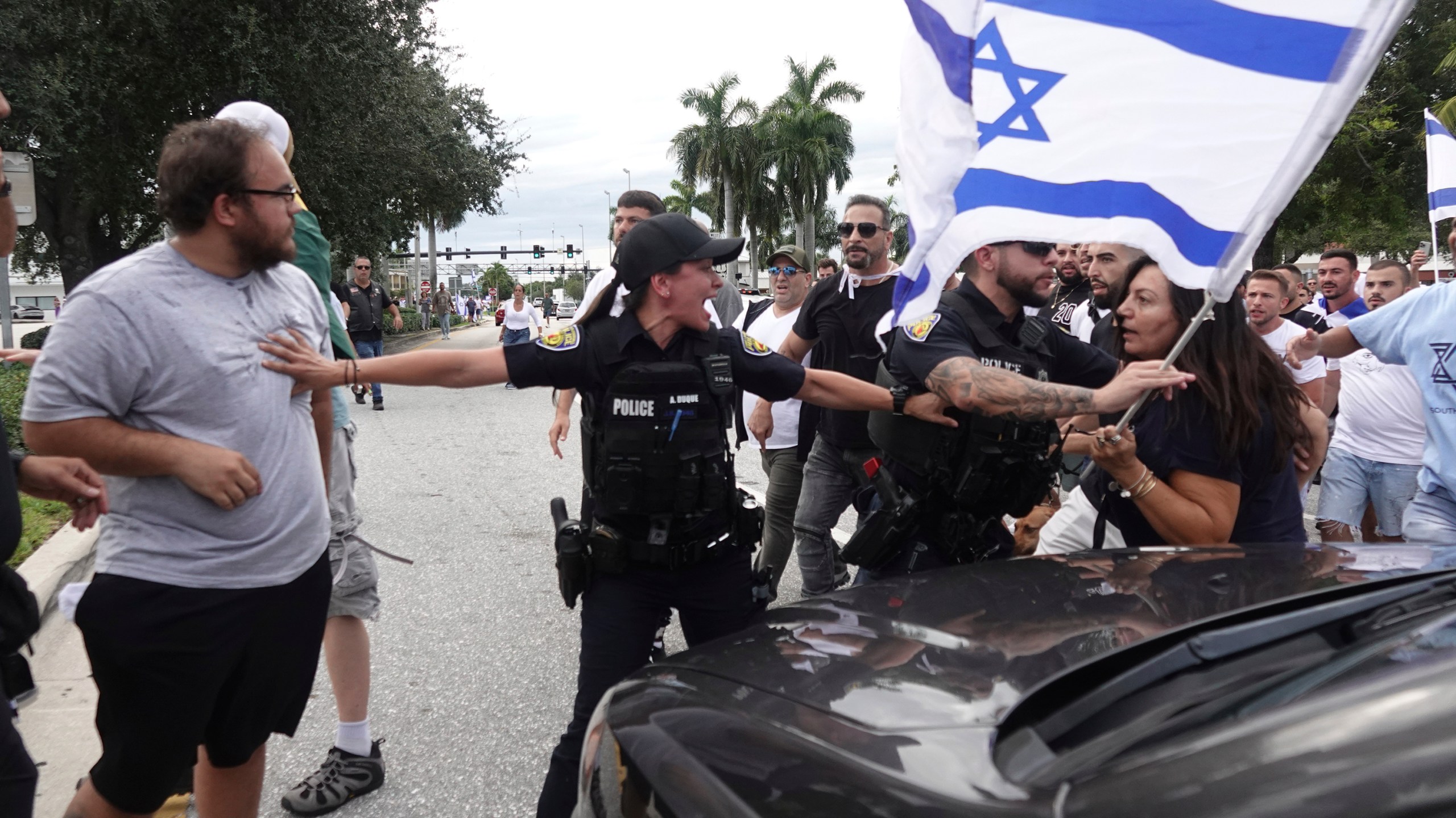 FILE - Fort Lauderdale police separate members of pro-Israel and pro-Palestinian protests, Sunday, Oct. 8, 2023, in Fort Lauderdale, Fla. State lawmakers across the country are expected consider legislation related to the Israel-Hamas war in 2024. (Joe Cavaretta/South Florida Sun-Sentinel via AP, File)