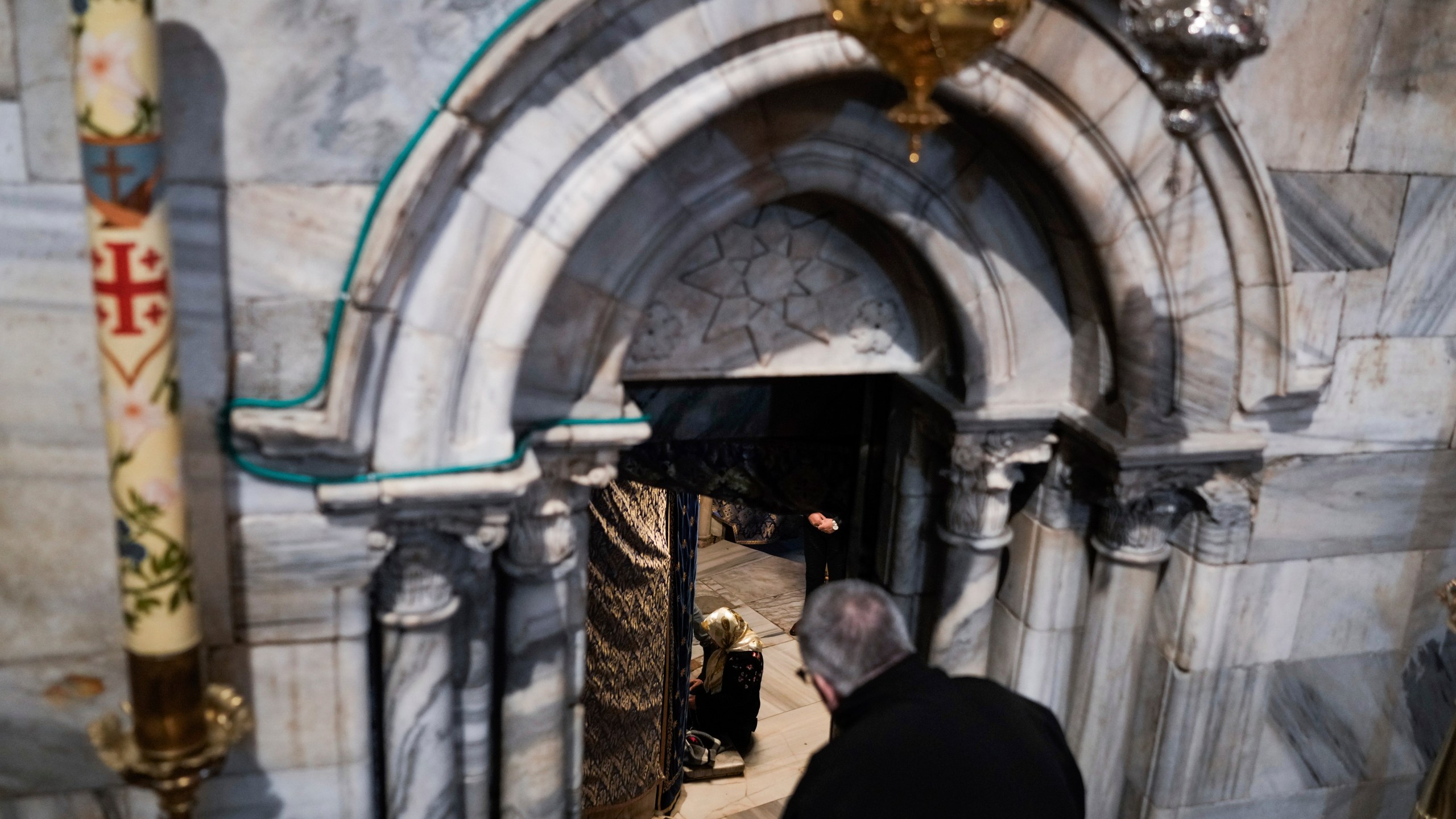 People visit the Grotto under the Church of the Nativity, traditionally believed to be the birthplace of Jesus, on Christmas Eve, in the West Bank city of Bethlehem, Sunday, Dec. 24, 2023. Bethlehem is having a subdued Christmas after officials in Jesus' traditional birthplace decided to forgo celebrations due to the Israel-Hamas war. (AP Photo/Leo Correa)