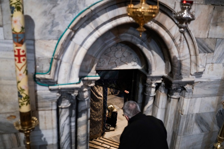 People visit the Grotto under the Church of the Nativity, traditionally believed to be the birthplace of Jesus, on Christmas Eve, in the West Bank city of Bethlehem, Sunday, Dec. 24, 2023. Bethlehem is having a subdued Christmas after officials in Jesus' traditional birthplace decided to forgo celebrations due to the Israel-Hamas war. (AP Photo/Leo Correa)