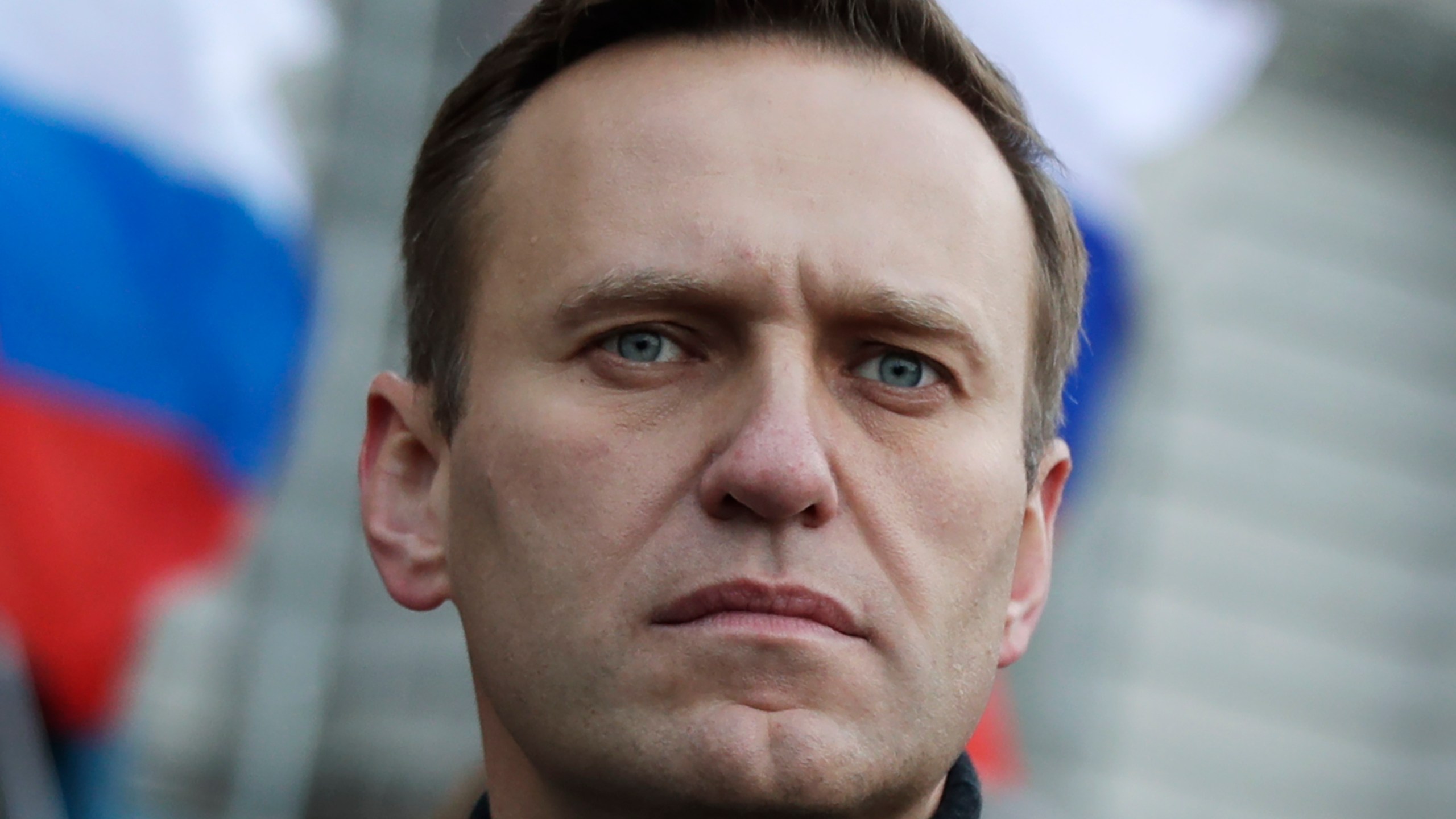 FILE - Russian opposition activist Alexei Navalny takes part in a march in memory of opposition leader Boris Nemtsov in Moscow, Russia on Feb. 29, 2020. Associates of imprisoned Russian opposition leader Alexei Navalny say he has been located at a prison colony above the Arctic Circle nearly three weeks after contact with him was lost. Navalny, the most prominent foe of Russian President Vladimir Putin, is serving a 19-year sentence on charges of extremism. (AP Photo/Pavel Golovkin, File)