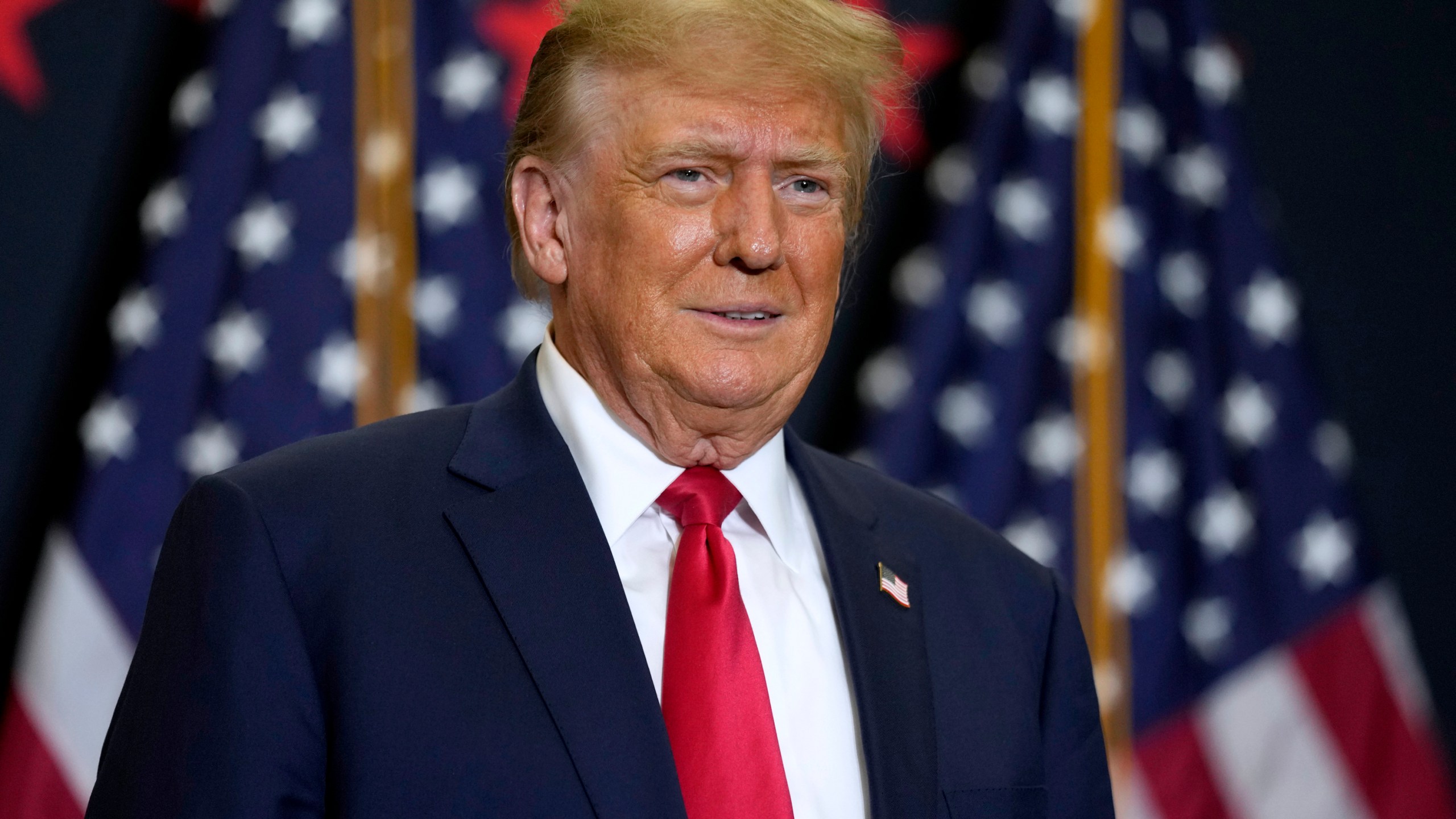 FILE - Former President Donald Trump speaks during a commit to caucus rally, Dec. 19, 2023, in Waterloo, Iowa. Police said Tuesday, Dec. 26, 2023, they are investigating incidents directed at Colorado Supreme Court justices and providing extra patrols around their homes in Denver following the court's decision to remove Trump from the state's presidential primary ballot. (AP Photo/Charlie Neibergall, File)