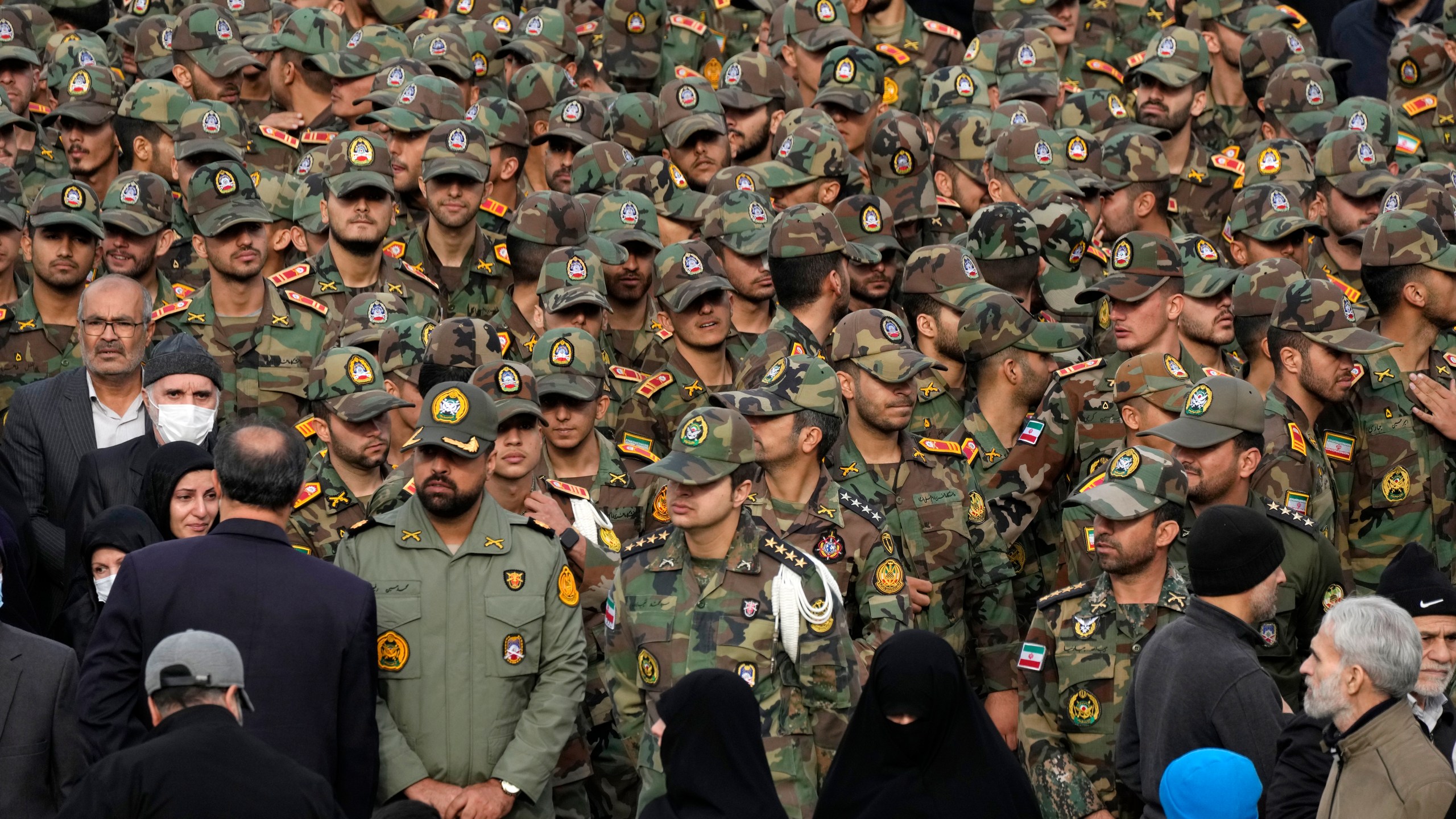 Iranian army cadets and officers attend the funeral ceremony of Seyed Razi Mousavi, a high ranking Iranian general of the paramilitary Revolutionary Guard, who was killed in an alleged Israeli airstrike in Syria on Monday, in Tehran, Iran, Thursday, Dec. 28, 2023. (AP Photo/Vahid Salemi)