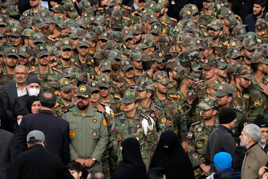 Iranian army cadets and officers attend the funeral ceremony of Seyed Razi Mousavi, a high ranking Iranian general of the paramilitary Revolutionary Guard, who was killed in an alleged Israeli airstrike in Syria on Monday, in Tehran, Iran, Thursday, Dec. 28, 2023. (AP Photo/Vahid Salemi)