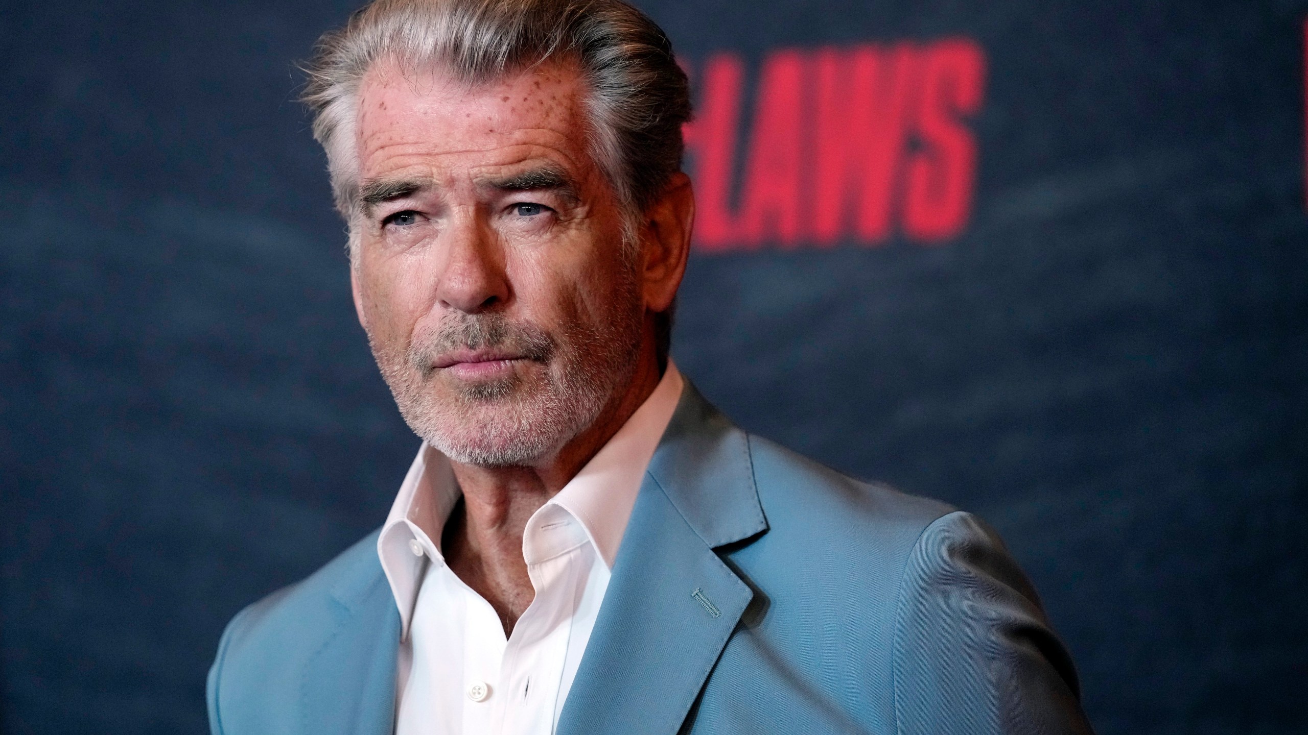 FILE - Pierce Brosnan, a cast member in "The Out-Laws," poses at a special screening of the film, Monday, June 26, 2023, at the Regal LA Live theaters in Los Angeles. Brosnan has been in hot water plenty of times as an actor playing the secret agent James Bond, though not in Yellowstone National Park. Now, for allegedly stepping out of bounds in a thermal area during a recent visit, Brosnan faces two citations and a court date in the world's oldest national park. (AP Photo/Chris Pizzello, File)