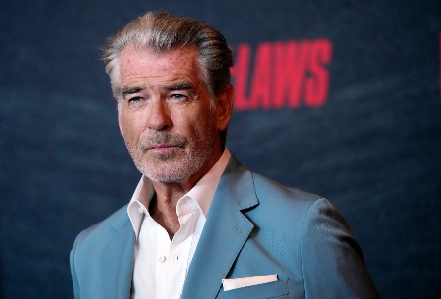 FILE - Pierce Brosnan, a cast member in "The Out-Laws," poses at a special screening of the film, Monday, June 26, 2023, at the Regal LA Live theaters in Los Angeles. Brosnan has been in hot water plenty of times as an actor playing the secret agent James Bond, though not in Yellowstone National Park. Now, for allegedly stepping out of bounds in a thermal area during a recent visit, Brosnan faces two citations and a court date in the world's oldest national park. (AP Photo/Chris Pizzello, File)