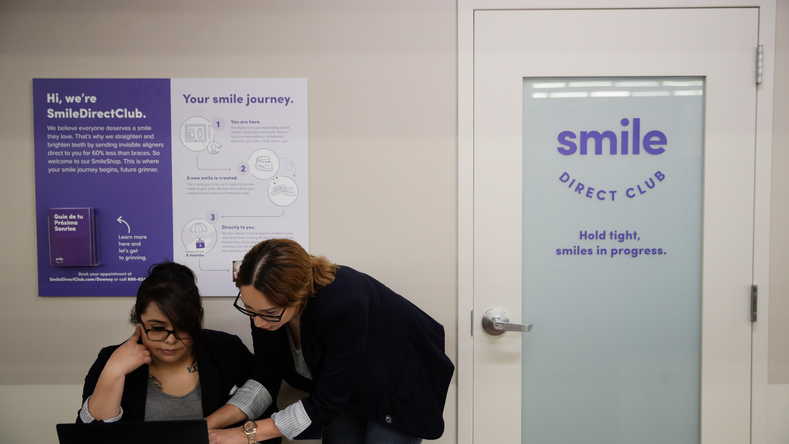 FILE - Dental assistants go over appointments at SmileDirectClub's SmileShop located inside a CVS store April 24, 2019, in Downey, Calif. SmileDirectClub is shutting down, just months after the struggling teeth-straightening company filed for bankruptcy, leaving existing customers in limbo. On Friday, Dec. 8, 2023, the company said it was unable to find a partner willing to bring in enough capital to keep the company afloat, despite a months-long search. (AP Photo/Jae C. Hong)