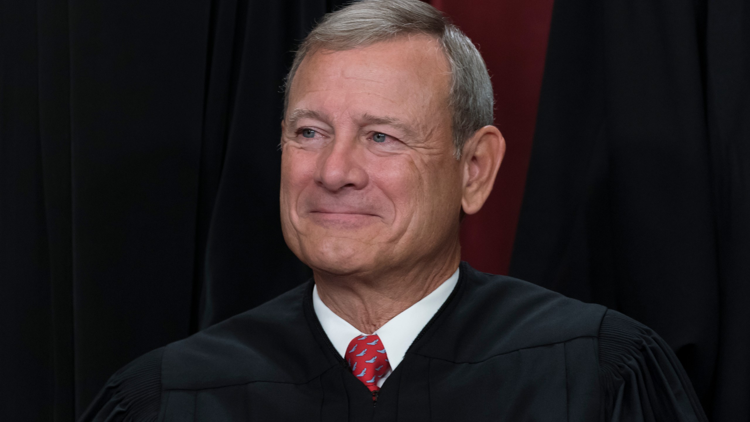 FILE - Chief Justice of the United States John Roberts joins other members of the Supreme Court as they pose for a new group portrait, at the Supreme Court building in Washington, Friday, Oct. 7, 2022. (AP Photo/J. Scott Applewhite, File)