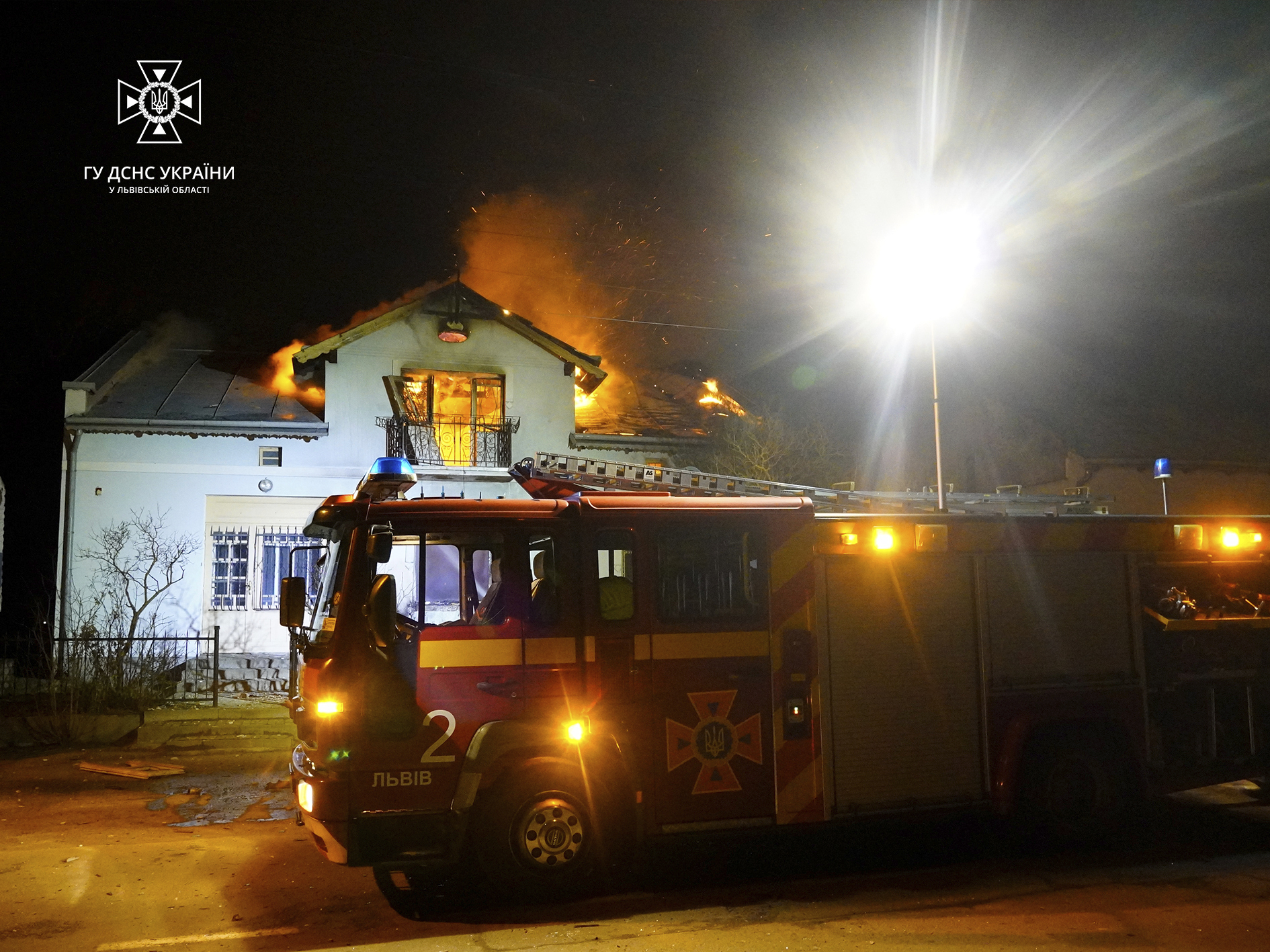 In this photo provided by the Ukrainian Emergency Service, a building is seen on fire after a Russian drone attack in Dublyany, Lviv region, Ukraine, Monday, Jan. 1, 2024. (Ukrainian Emergency Service via AP)