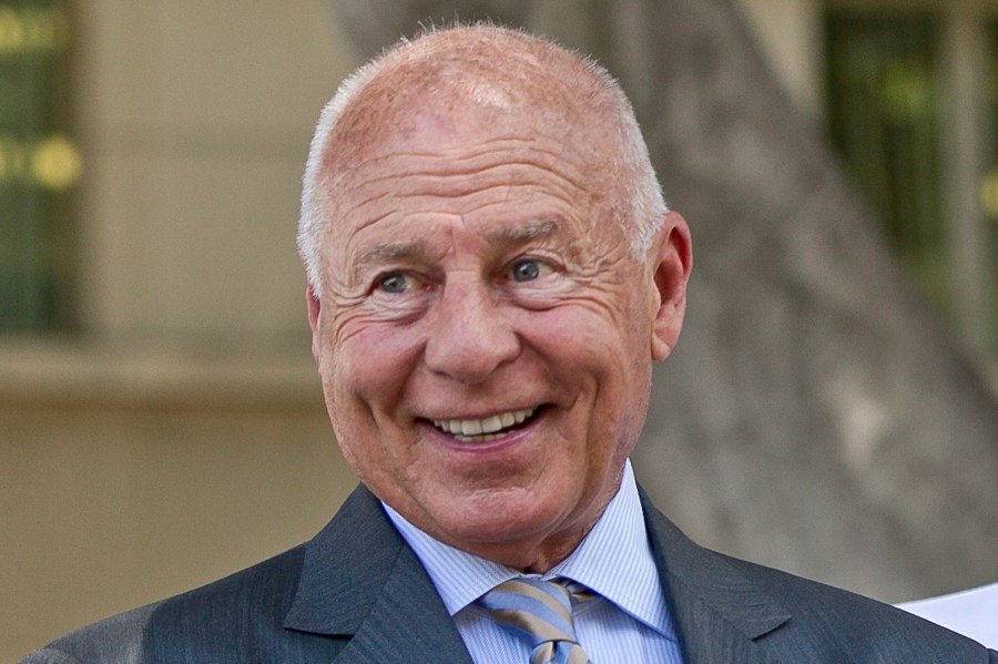 FILE - Attorney Tom Girardi smiles outside the Los Angeles courthouse on Wednesday, July 9, 2014. A federal judge filed a brief order Tuesday, Jan. 2, 2024, stating that the disgraced Los Angeles celebrity lawyer has been found competent to stand trial on charges that he stole more than $15 million from his clients. (AP Photo/Damian Dovarganes, File)