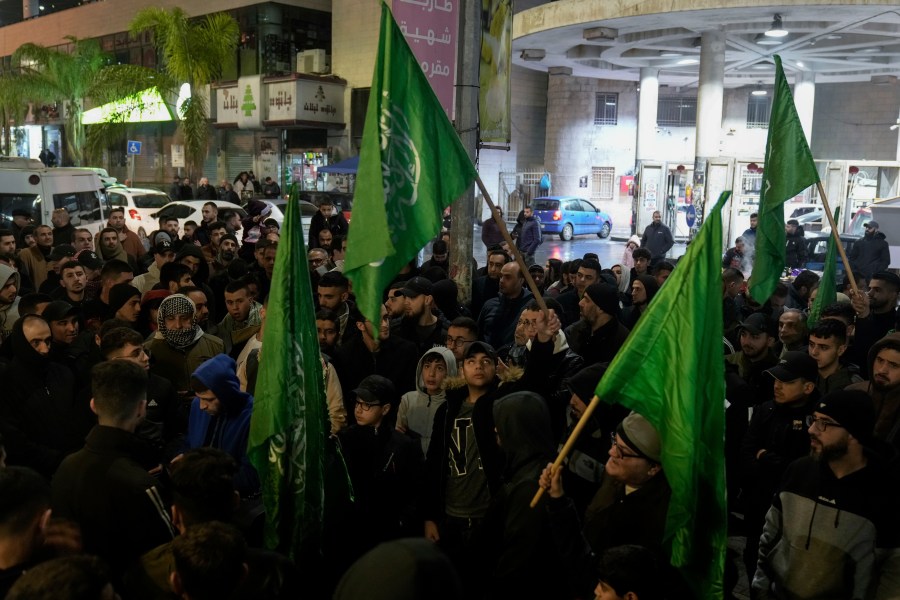 Palestinian demonstrators wave Hamas flags and shout slogans during a protest following the killing of top Hamas official Saleh Arouri in Beirut, in the West Bank city of Nablus on Tuesday, Jan. 2, 2024. Arouri, the No. 2 figure in Hamas, was killed in an explosion blamed on Israel. He is the highest-ranked Hamas figure to be killed in the nearly three-month war between Israel and Hamas. (AP Photo/Majdi Mohammed)