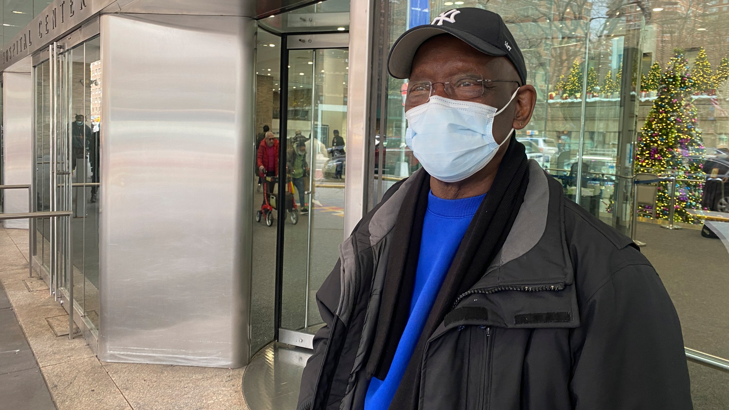 Taikwan Wright waits outside while his nephew is treated for asthma in the ICU in Bellevue Hospital in New York on Wednesday, Jan. 3, 2023. The previous week, New York City resumed a mask mandate for the city’s 11 public hospitals. (AP Photo/Mary Conlon)