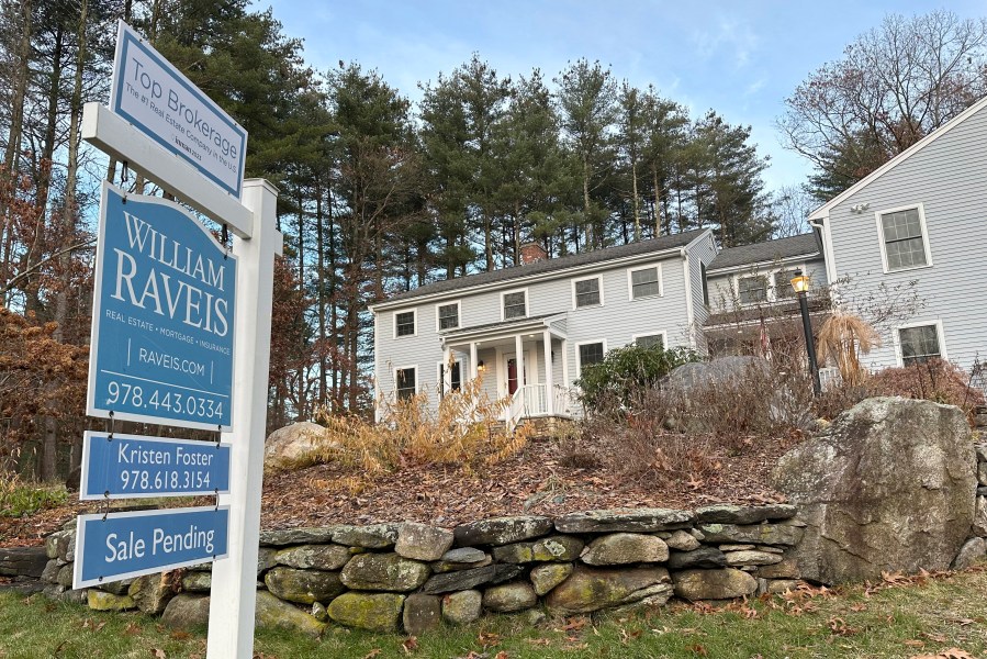 A sale pending sign is displayed in front of a home in Sudbury, Mass., on Saturday, Dec. 2, 2023. On Thursday, Freddie Mac reports on this week's average U.S. mortgage rates. (AP Photo/Peter Morgan)