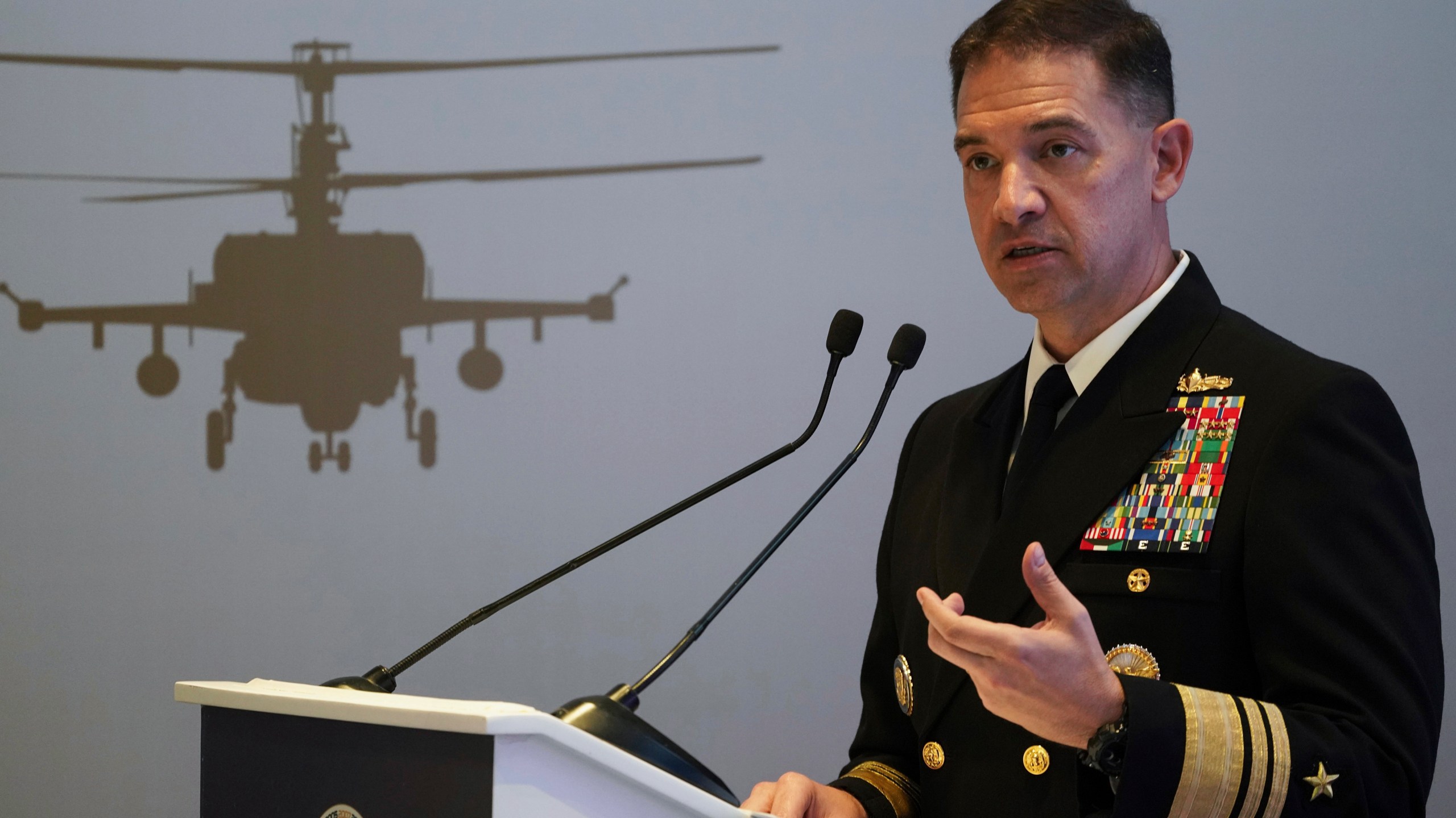 FILE - U.S. Navy Vice Adm. Brad Cooper, who heads the Navy's Bahrain-based 5th Fleet, speaks at an event at the International Defense Exhibition and Conference in Abu Dhabi, United Arab Emirates, Feb. 21, 2023. The top commander of U.S. naval forces in the Middle East says Yemen’s Houthi rebels are showing no signs of ending their “reckless” attacks on commercial ships in the Red Sea. But Vice Adm. Brad Cooper said in an Associated Press interview on Saturday that more nations are joining the international maritime mission to protect vessels in the vital waterway and trade traffic is beginning to pick up. (AP Photo/Jon Gambrell, File)