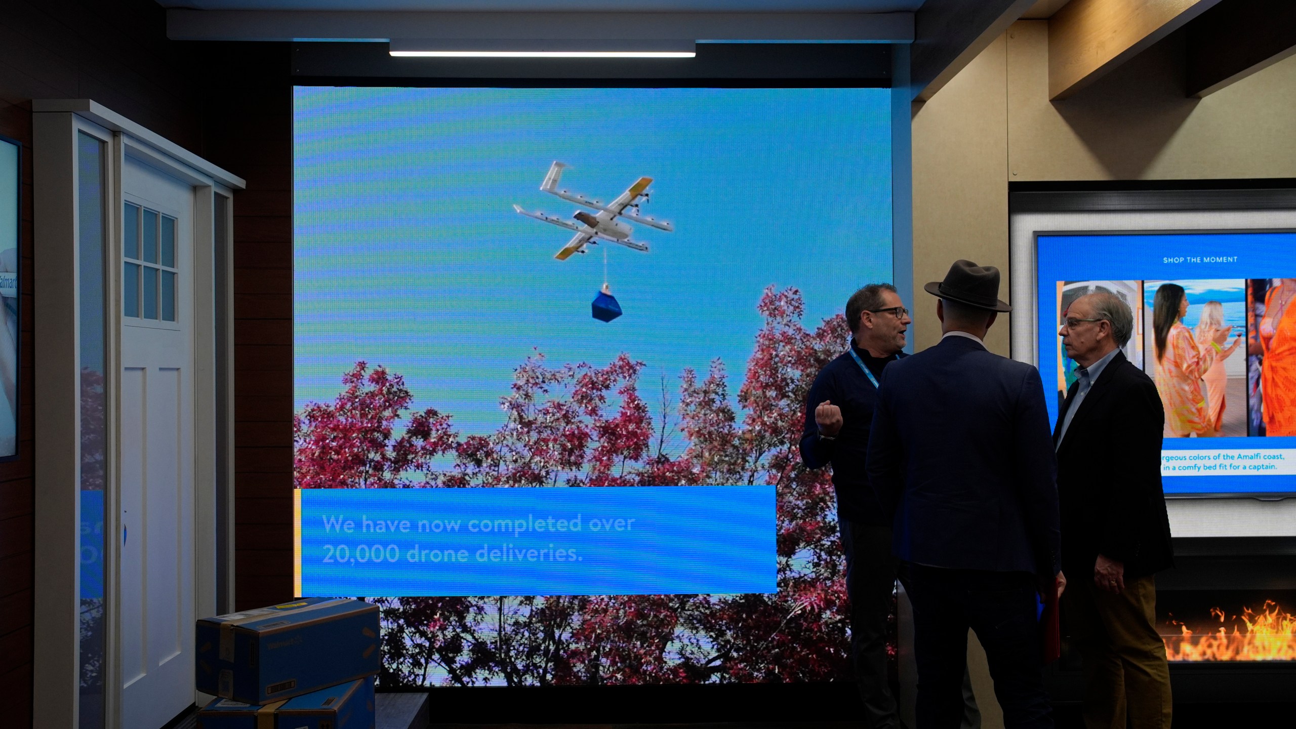 A screen shows drone deliveries at the Walmart booth during the CES tech show Tuesday, Jan. 9, 2024, in Las Vegas. (AP Photo/John Locher)