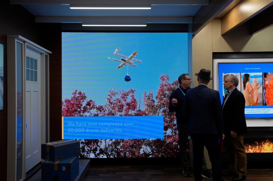 A screen shows drone deliveries at the Walmart booth during the CES tech show Tuesday, Jan. 9, 2024, in Las Vegas. (AP Photo/John Locher)