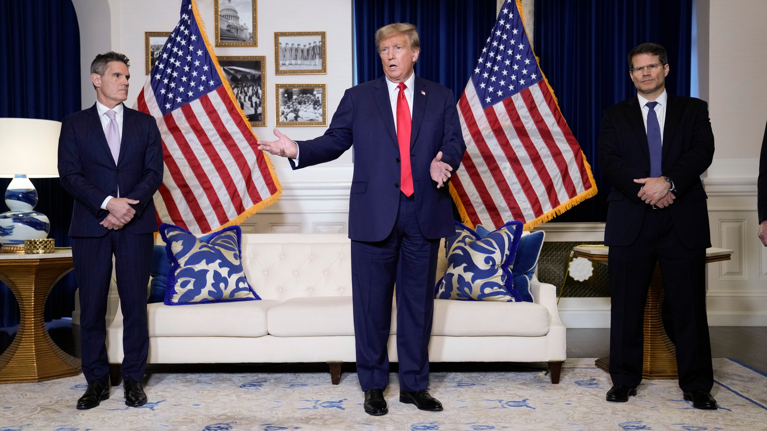 Former President Donald Trump speaks to the media at a Washington hotel, Tuesday, Jan. 9, 2024, after attending a hearing before the D.C. Circuit Court of Appeals at the federal courthouse in Washington, with attorneys John Lauro, left, and D. John Sauer, right. (AP Photo/Susan Walsh)