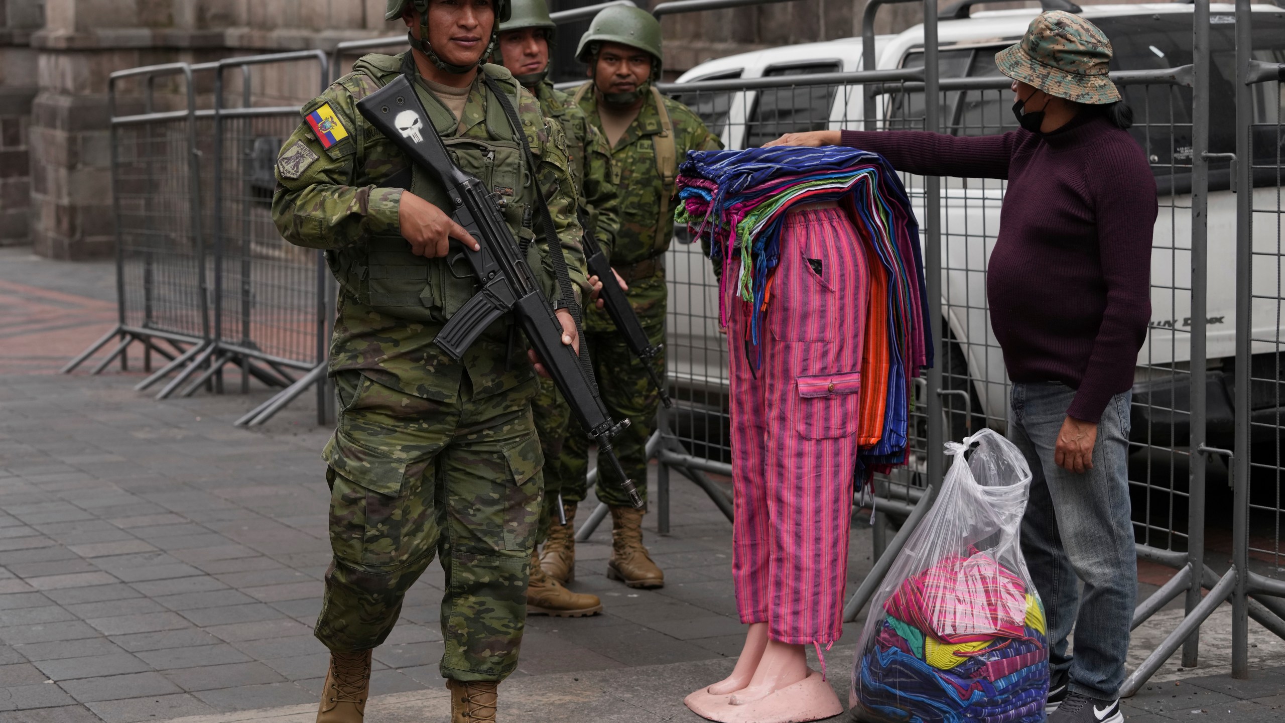 Soldiers patrol outside the government palace during a state of emergency in Quito, Ecuador, Tuesday, Jan. 9, 2024. The country has seen a series of attacks after the government imposed a state of emergency in the wake of the apparent escape of a powerful gang leader from prison. (AP Photo/Dolores Ochoa)