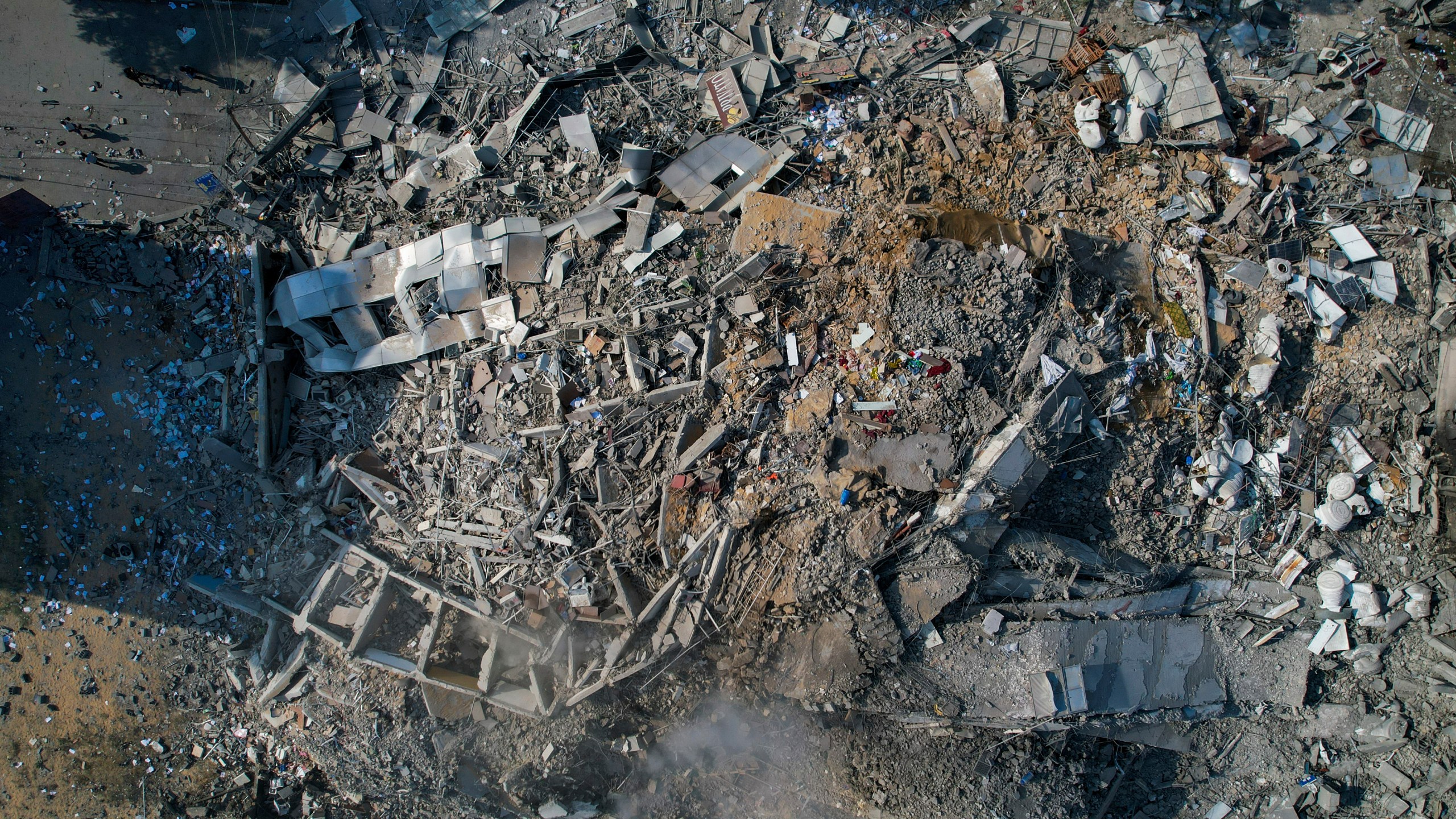 FILE - A view of the rubble of a building after it was struck by an Israeli airstrike, in Gaza City, on Oct. 8, 2023. After 11 weeks of war in Gaza, the Israeli military campaign against Hamas now sits among the deadliest and most destructive in history. The Palestinian death toll is approaching 20,000 and satellite data shows that one-third of structures across the tiny enclave have been destroyed. (AP Photo/Hatem Moussa, File)