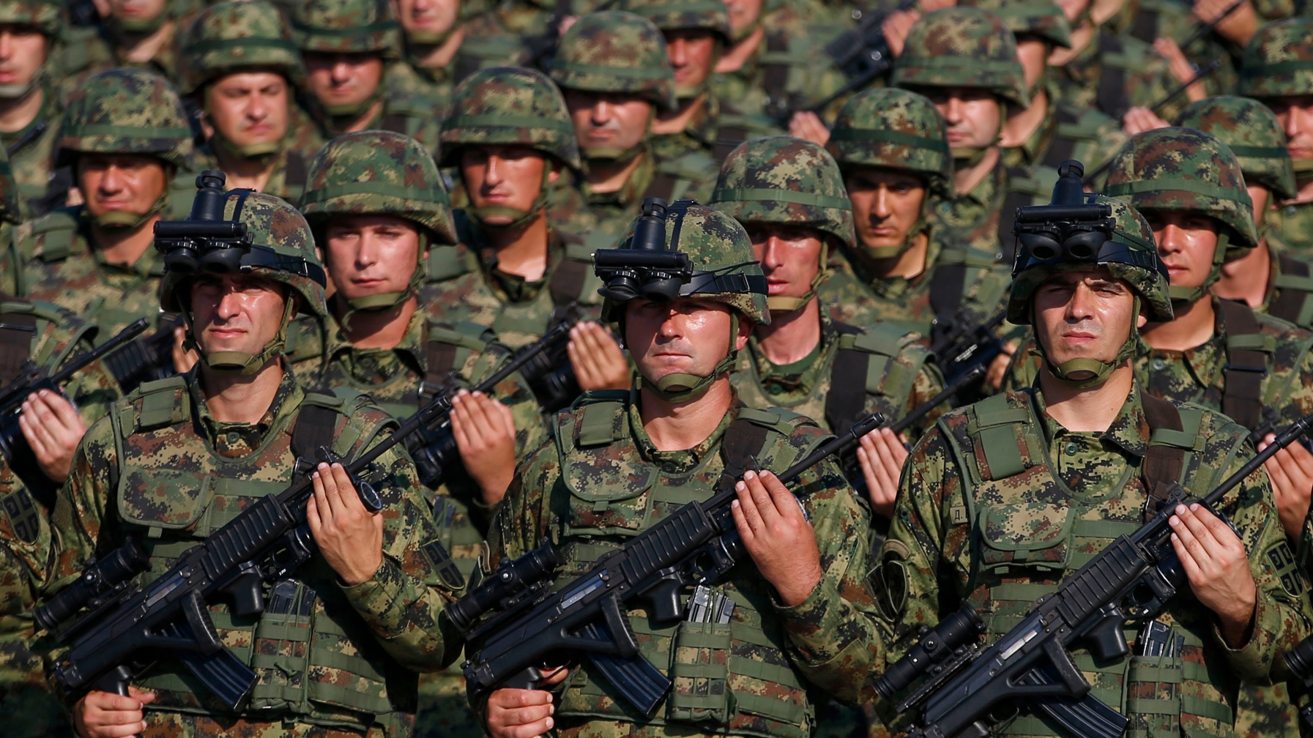 FILE - Serbian Army soldiers perform during a military parade at the military airport Batajnica, near Belgrade, Serbia, on Oct. 19, 2019. Serbia looks set to reintroduce the obligatory military service for its young citizens, the army command said Thursday, Jan. 4, 2024 in a move that comes amid rising tensions in the Balkans. (AP Photo/Darko Vojinovic, File)