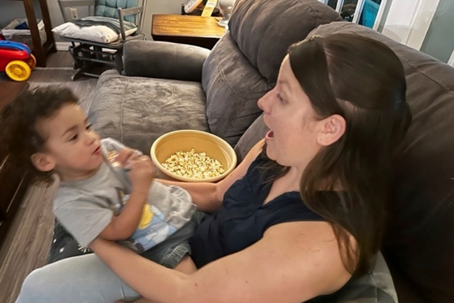 Megan Cherry plays with her two-year-old son on the couch in their home in Temple Terrace, Fla., on Tuesday, Jan. 9, 2024. Cherry is among millions of Americans who are feeling the ongoing impacts of inflation. (AP Photo/Laura Bargfeld)