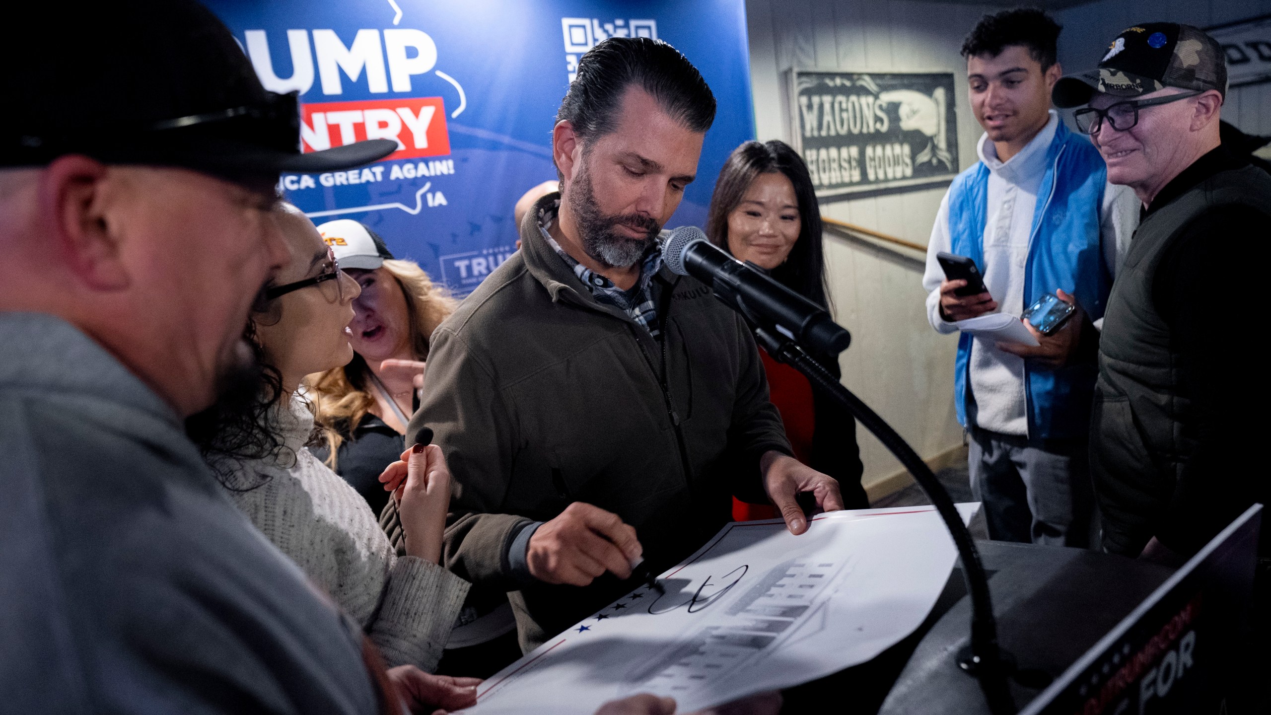 Donald Trump, Jr. greets members of the audience after speaking at the Machine Shed in Urbandale, Iowa, Thursday, Jan. 11, 2024. (AP Photo/Andrew Harnik)