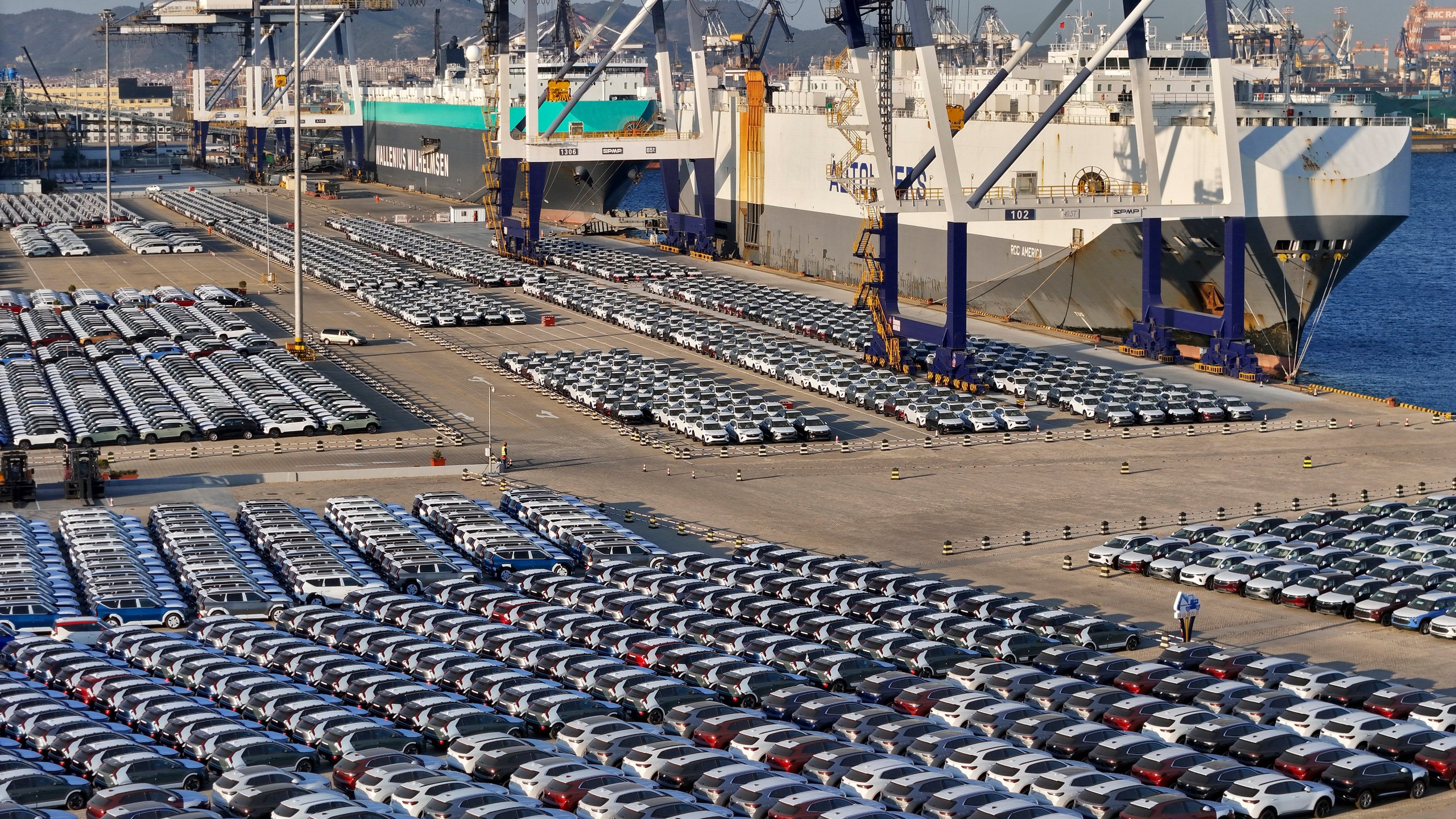 New cars for export waiting for transportation on a vehicles carrier vessel at a dockyard in Yantai in east China's Shandong province on Nov. 2, 2023. China's auto exports surged 63.7% in 2023 while sales at home, boosted by year-end incentives, rose 4.2%, an industry association said Thursday, Jan. 11.(Chinatopix via AP)