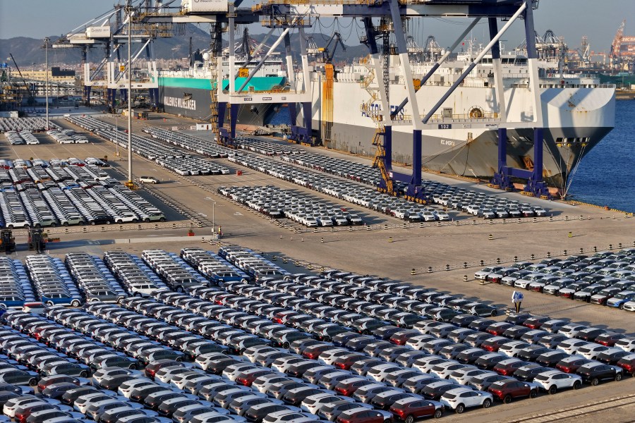 New cars for export waiting for transportation on a vehicles carrier vessel at a dockyard in Yantai in east China's Shandong province on Nov. 2, 2023. China's auto exports surged 63.7% in 2023 while sales at home, boosted by year-end incentives, rose 4.2%, an industry association said Thursday, Jan. 11.(Chinatopix via AP)