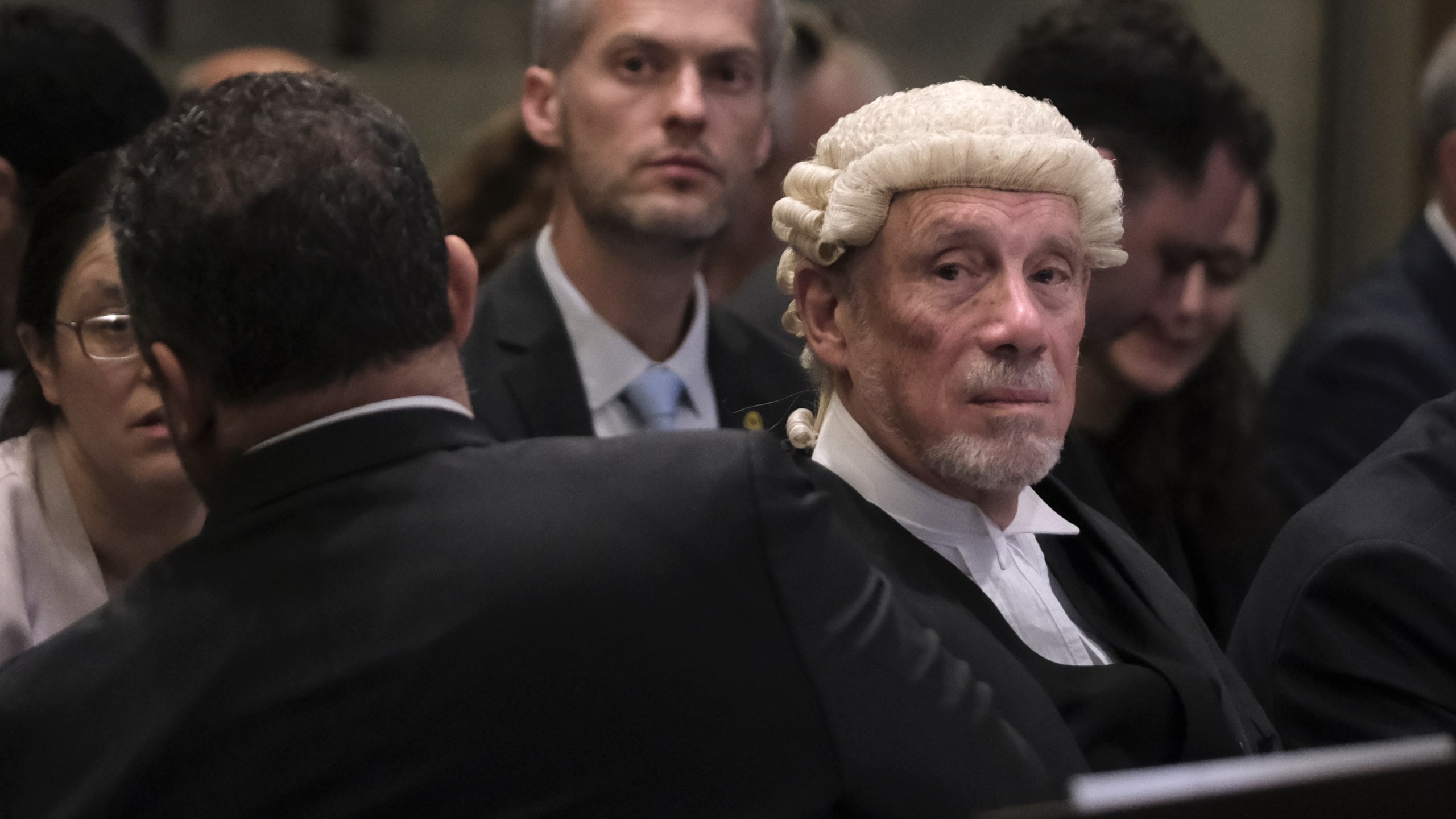 British jurist Malcolm Shaw, right, looks on during a hearing at the International Court of Justice in The Hague, Netherlands, Friday, Jan. 12, 2024. The United Nations' top court opened hearings Thursday into South Africa's allegation that Israel's war with Hamas amounts to genocide against Palestinians, a claim that Israel strongly denies. (AP Photo/Patrick Post)