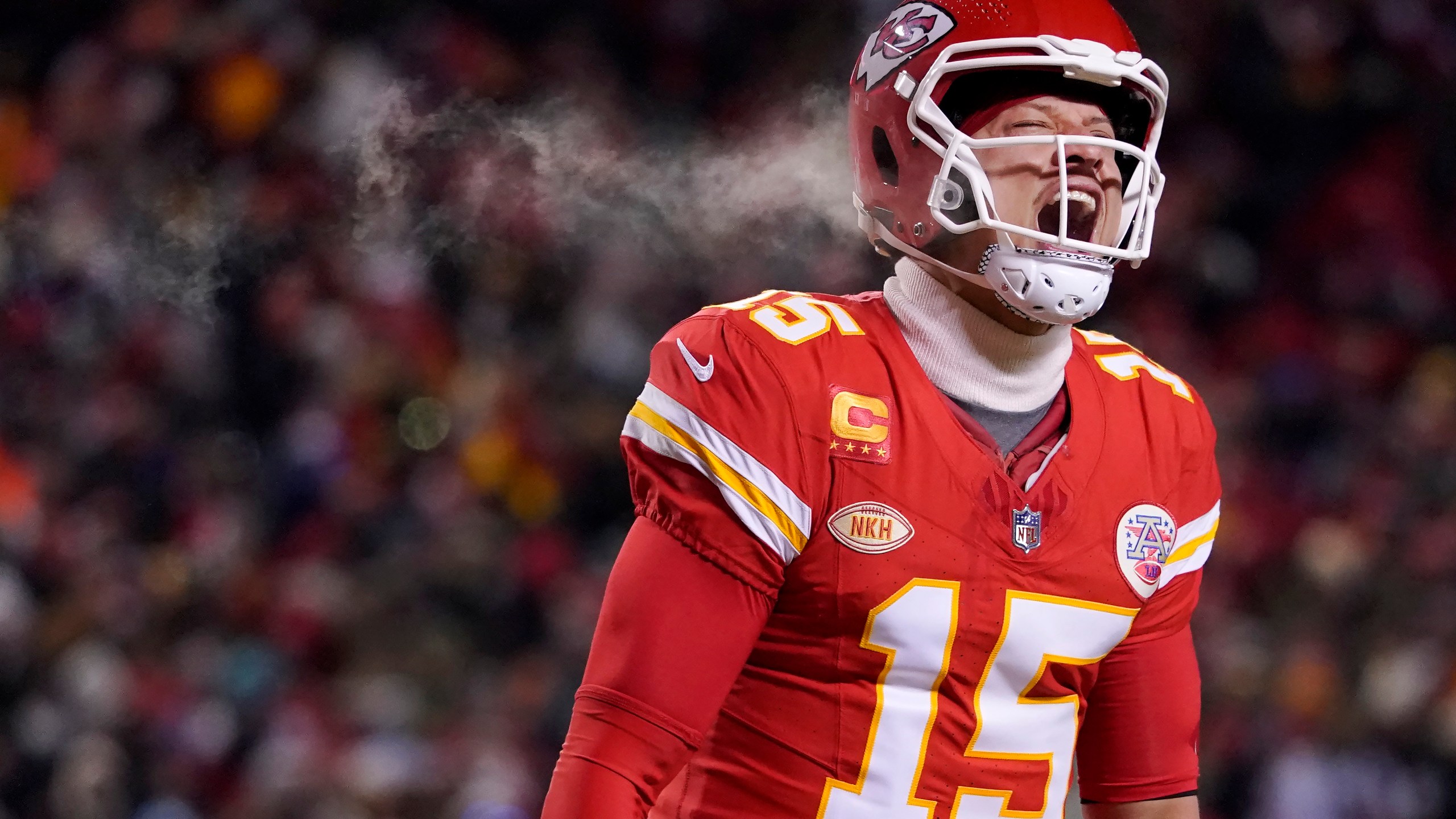 Kansas City Chiefs quarterback Patrick Mahomes (15) celebrates after throwing a touchdown pass during the first half of an NFL wild-card playoff football game against the Miami Dolphins Saturday, Jan. 13, 2024, in Kansas City, Mo. (AP Photo/Ed Zurga)