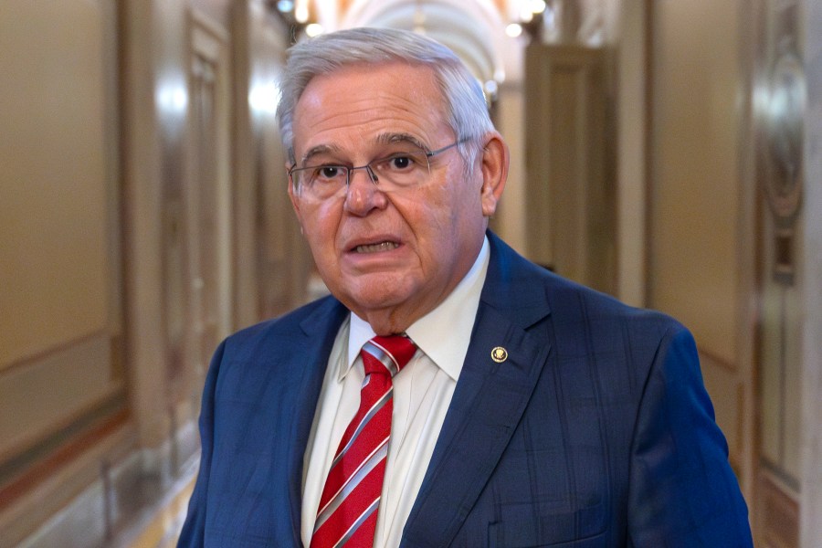 FILE - Sen. Bob Menendez, D-N.J., departs the Senate floor in the Capitol, Sept. 28, 2023, in Washington. Menendez introduced a member of the Qatari royal family and principal in a company with ties to the government of Qatar to a New Jersey businessman before the company invested millions of dollars in the businessman's real estate project, a rewritten indictment alleged Tuesday, Jan. 2, 2024. (AP Photo/Alex Brandon, File)