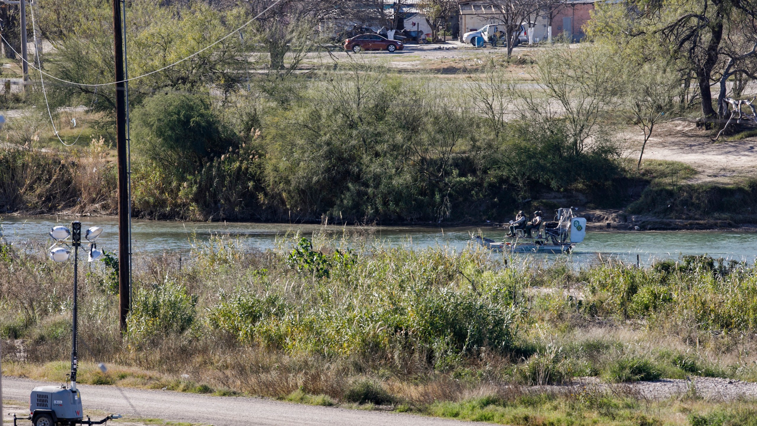 Texas Department of Public Safety officers work inside a fenced off Shelby Park, Thursday, Jan. 11, 2024, in Eagle Pass, Texas. The Justice Department on Friday, Jan. 12, asked the Supreme Court to order Texas to stop blocking Border Patrol agents from a portion of the U.S.-Mexico border where large numbers of migrants have crossed in recent months, setting up another showdown between Republican Gov. Greg Abbott and the Biden administration over immigration enforcement. (Sam Owens /The San Antonio Express-News via AP)