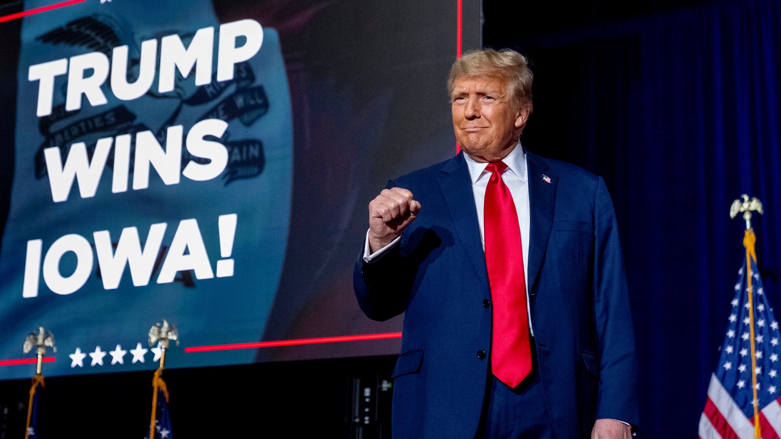 Republican presidential candidate former President Donald Trump takes the stage at a caucus night party in Des Moines, Iowa, Monday, Jan. 15, 2024. (AP Photo/Andrew Harnik)