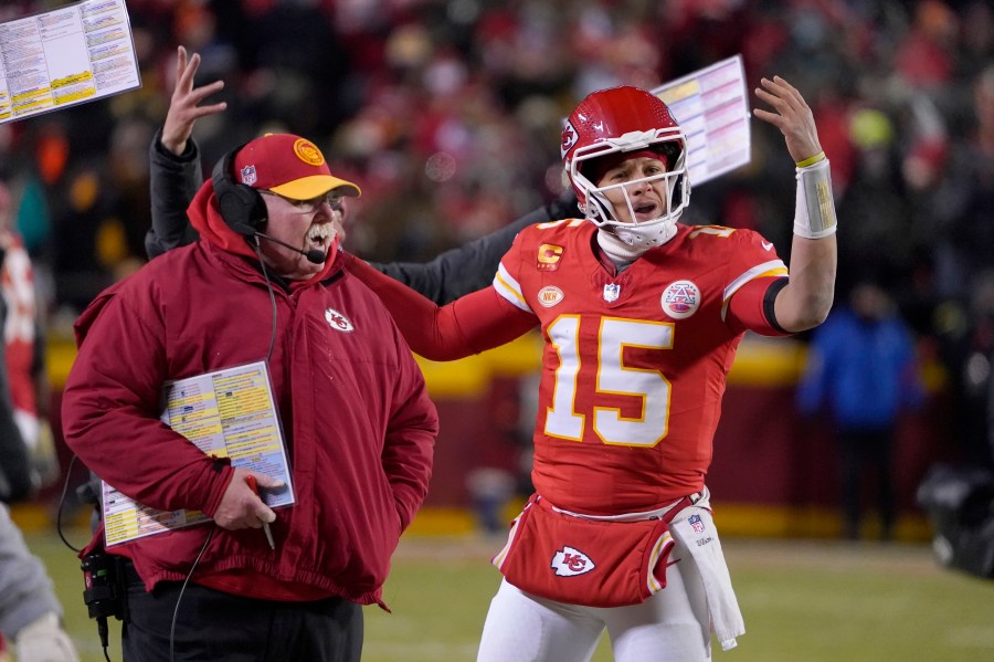 Kansas City Chiefs head coach Andy Reid, left, and quarterback Patrick Mahomes (15) react toward officials during the first half of an NFL wild-card playoff football game against the Miami Dolphins Saturday, Jan. 13, 2024, in Kansas City, Mo. (AP Photo/Ed Zurga)