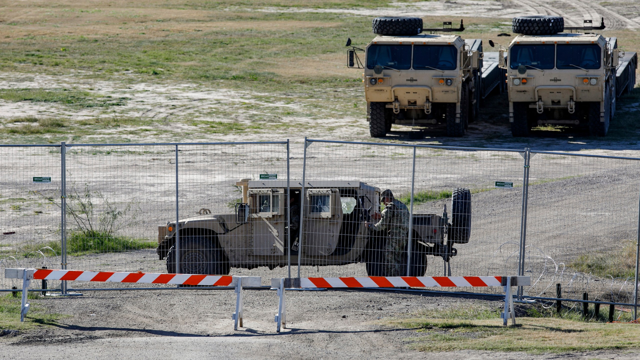 A Texas Department of Public Safety officer guards an entrance to Shelby Park, Thursday, Jan. 11, 2024, in Eagle Pass, Texas. The Justice Department on Friday, Jan. 12, asked the Supreme Court to order Texas to stop blocking Border Patrol agents from a portion of the U.S.-Mexico border where large numbers of migrants have crossed in recent months, setting up another showdown between Republican Gov. Greg Abbott and the Biden administration over immigration enforcement. (Sam Owens /The San Antonio Express-News via AP)