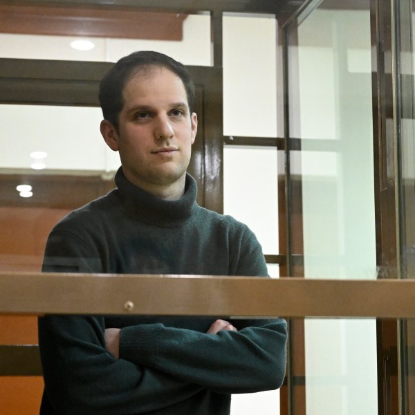 FILE - Wall Street Journal reporter Evan Gershkovich stands in a glass cage in a courtroom at the Moscow City Court, in Moscow, Russia, on Dec. 14, 2023. An estimated 320 journalists around the world were imprisoned because of their work toward the end of 2023. That's from the Committee to Protect Journalists, which on Thursday, Jan. 18, 2024 issued its annual census as of Dec. 1, 2023. (AP Photo/Dmitry Serebryakov, file)