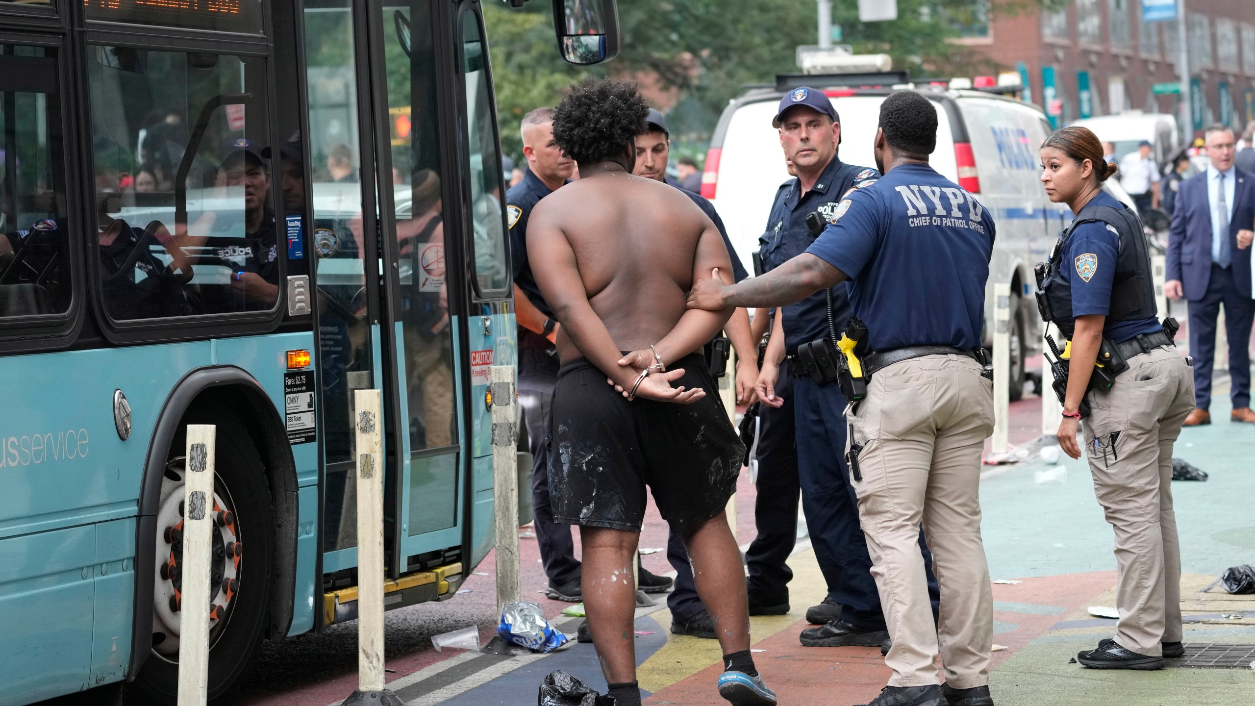 FILE - New York City Police Department officers arrest a man, Aug. 4, 2023, in New York's Union Square. New York Mayor Eric Adams announced Friday, Jan 19, 2024, that he rejected a bill, known as the "How Many Stops Act," which requires officers to publicly report on all investigative stops, including relatively low-level encounters with civilians. The Democratic-led City Council approved the measure in the final days of 2023 with enough votes to overrule a mayoral veto and ensure that the bill becomes law unless several members change their stance. (AP Photo/Mary Altaffer, File)