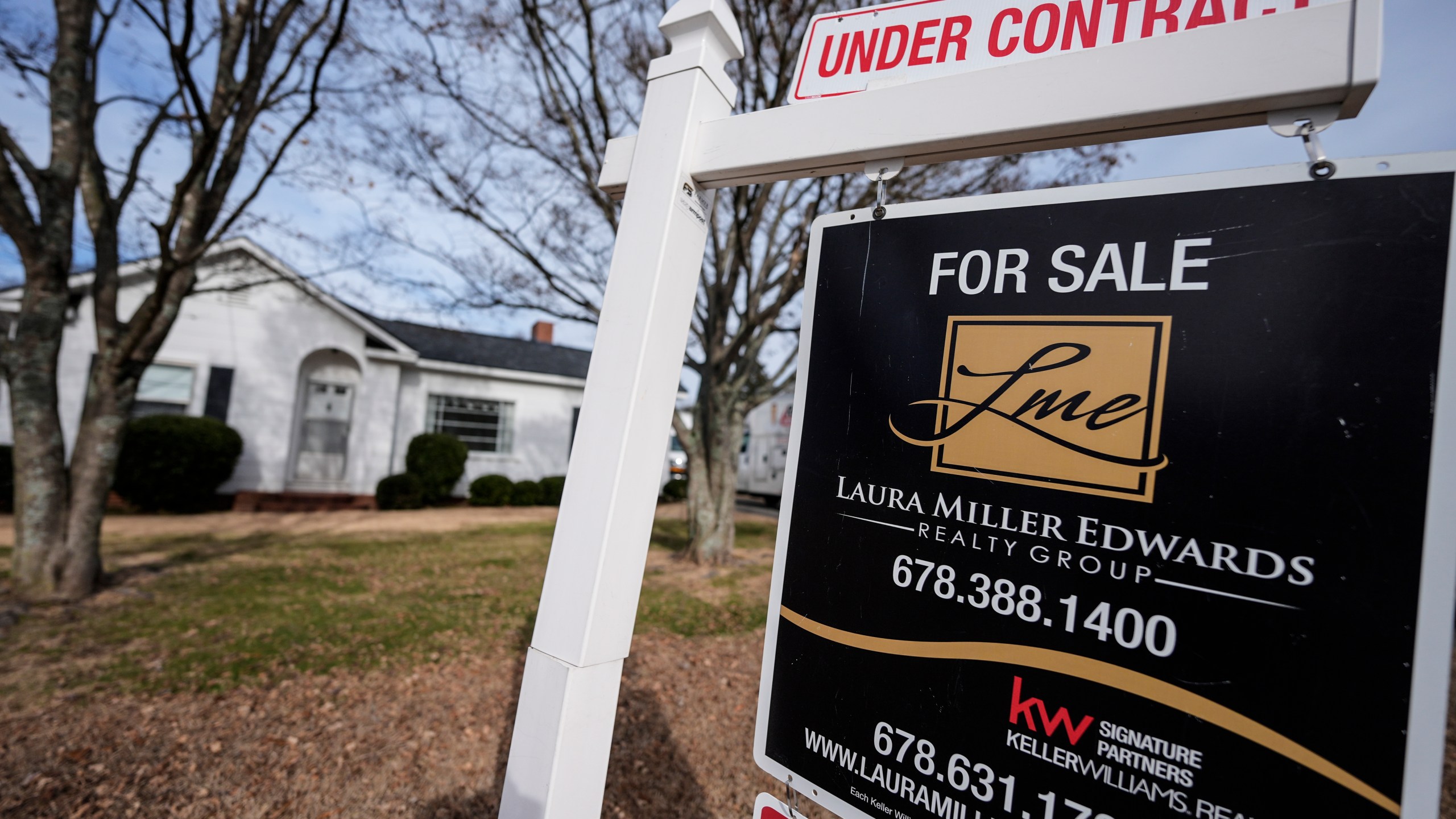 A sign indicating that a home is under contract is shown on Tuesday, Jan. 16, 2024, in Kennesaw, Ga. On Friday, the National Association of Realtors reports on existing home sales for December. (AP Photo/Mike Stewart)