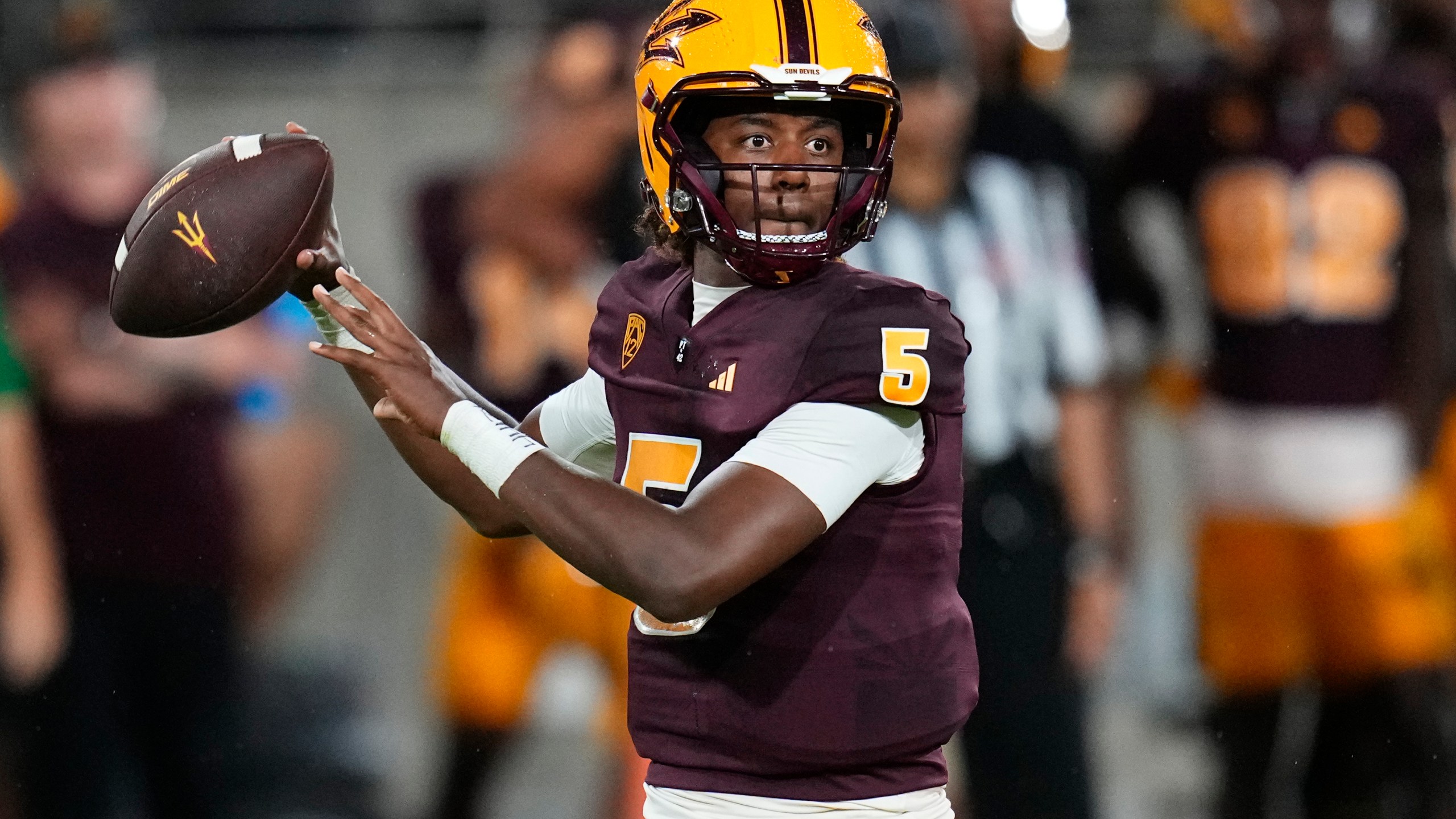 FILE - Arizona State quarterback Jaden Rashada looks for a receiver during the team's NCAA college football game against Southern Utah on Sept. 1, 2023, in Tempe, Ariz. Florida is under NCAA investigation a year after a failed name, image and likeness deal worth more than $13 million with former signee Rashada. Rashada signed with Florida last December only to be granted his release a month later after his NIL deal fell through. He later signed with Arizona State. (AP Photo/Ross D. Franklin, File)