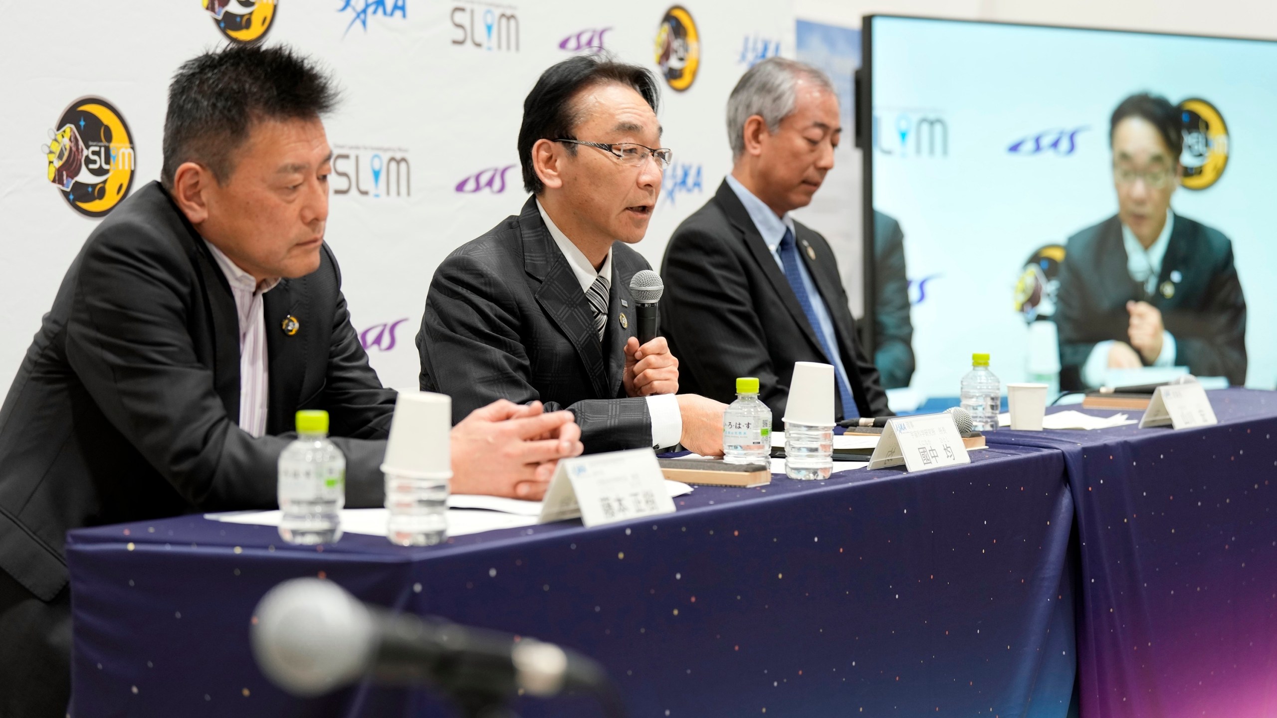 Representatives of Japan Aerospace Exploration Agency (JAXA) Masaki Fujimoto, left, Hitoshi Kuninaka, center, and Hiroshi Yamakawa, right, attend a press conference on the pinpoint moon landing operation by the Smart Lander for Investigating Moon (SLIM) spacecraft at JAXA's Sagamihara Campus Saturday, Jan. 20, 2024, in Sagamihara near Tokyo. Japan's space agency said early Saturday that its spacecraft is on the moon, but is still "checking its status." More details will be given at a news conference, officials said. (AP Photo/Eugene Hoshiko)