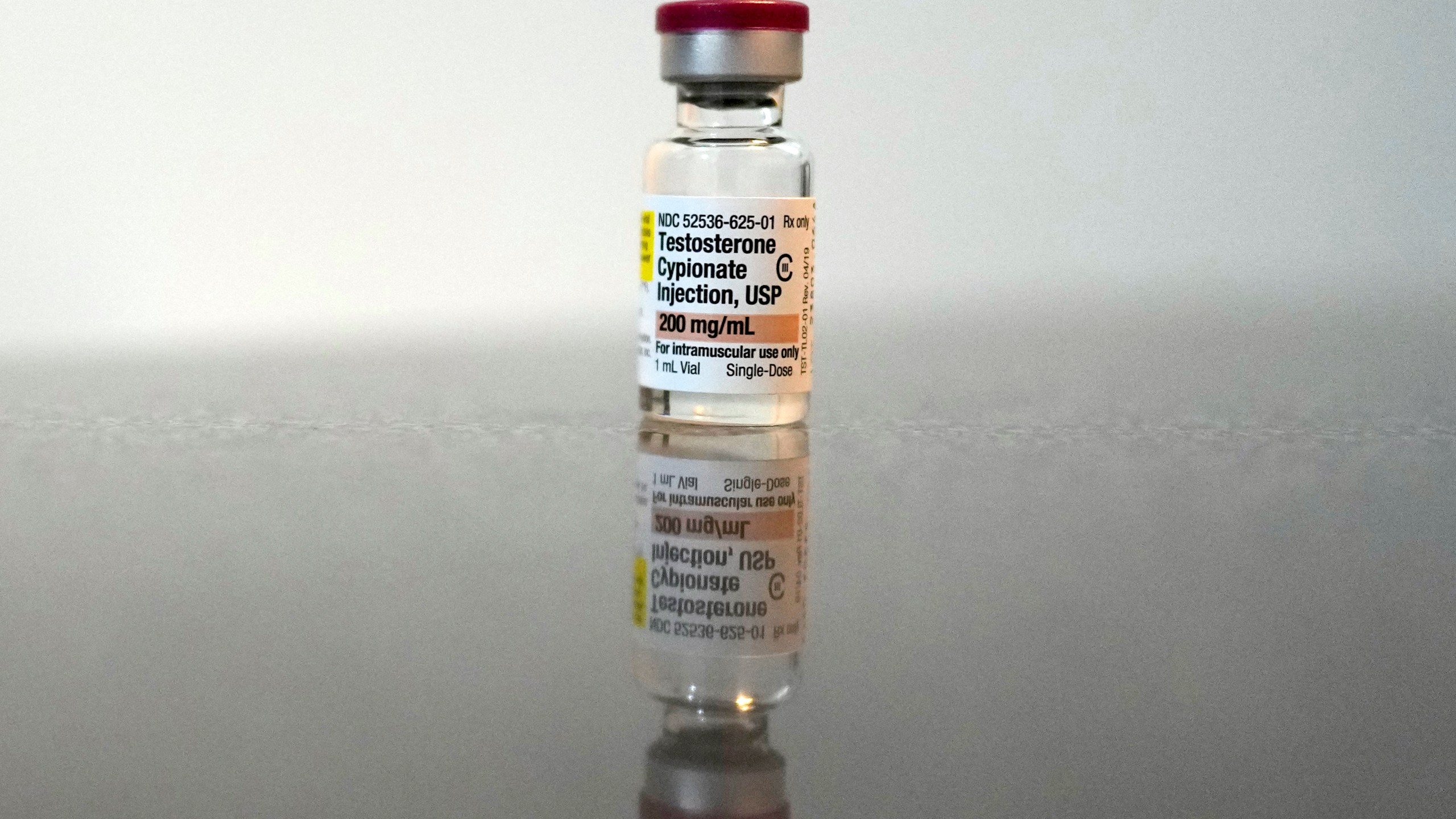 A vial of Testosterone Cypionate Injection is seen on the bathroom counter in Ashton Colby's apartment in Columbus, Ohio, on Thursday, Jan. 18, 2024. Ohio Gov. Mike DeWine announced proposals this month that transgender advocates say could block access to gender-affirming care provided by independent clinics and general practitioners, leaving thousands of adults scrambling for treatment and facing health risks. Colby, 31, fears the clinic where he gets the testosterone he has taken since age 19 would no longer offer it. (AP Photo/Carolyn Kaster)