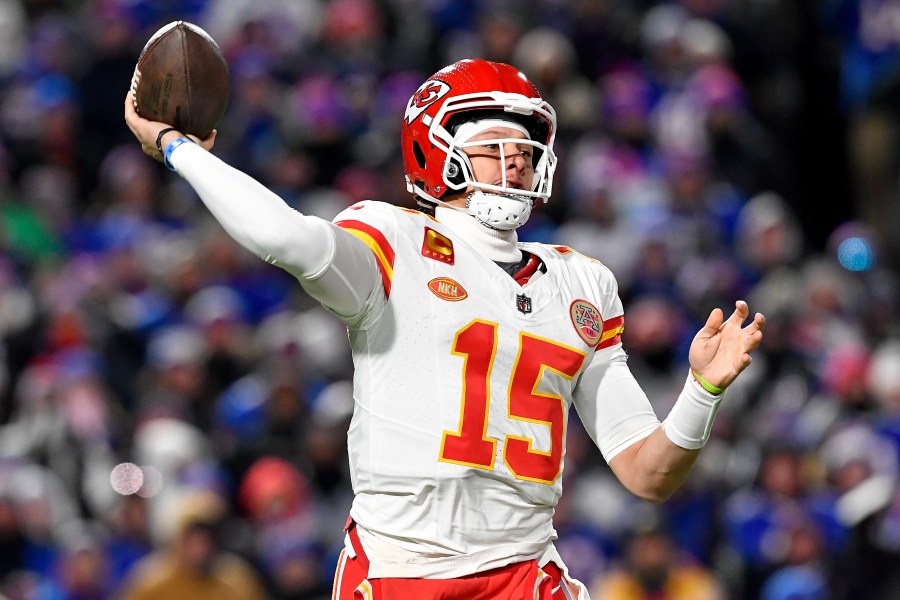 Kansas City Chiefs quarterback Patrick Mahomes (15) passes against the Buffalo Bills during the first quarter of an NFL AFC division playoff football game, Sunday, Jan. 21, 2024, in Orchard Park, N.Y. (AP Photo/Adrian Kraus)