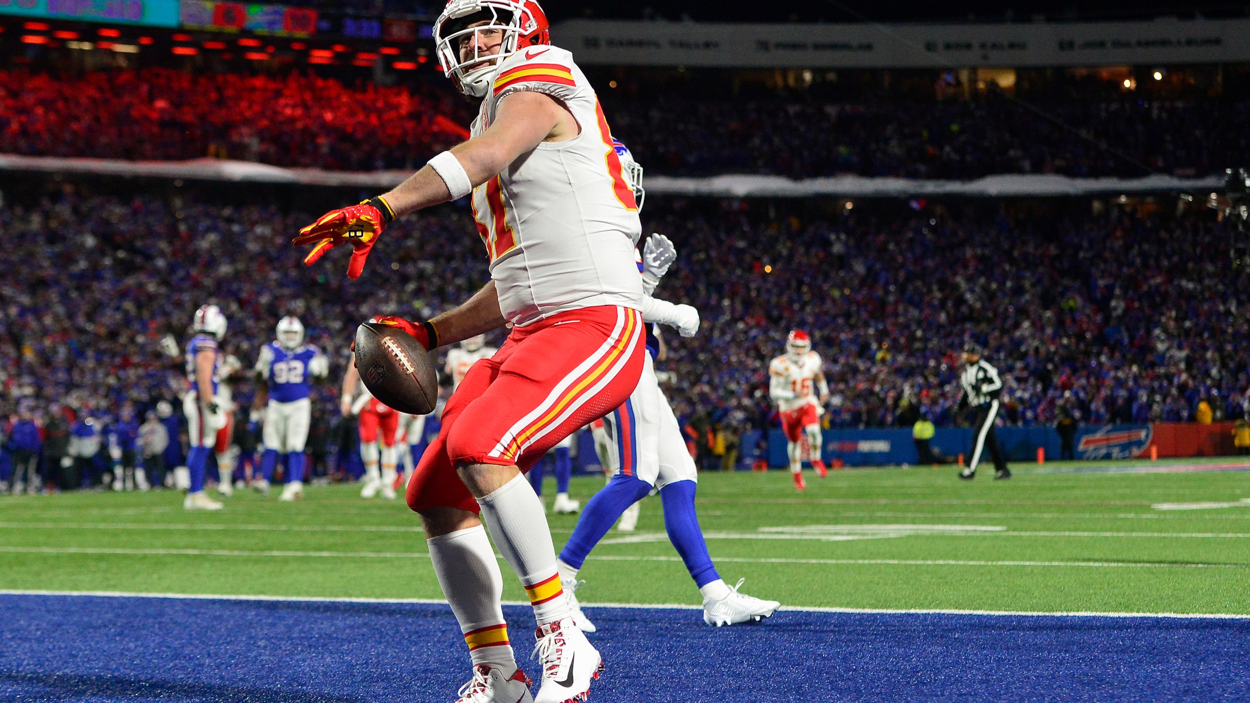 Kansas City Chiefs tight end Travis Kelce (87) reacts after scoring a touchdown against the Buffalo Bills during the second quarter of an NFL AFC division playoff football game, Sunday, Jan. 21, 2024, in Orchard Park, N.Y. (AP Photo/Adrian Kraus)