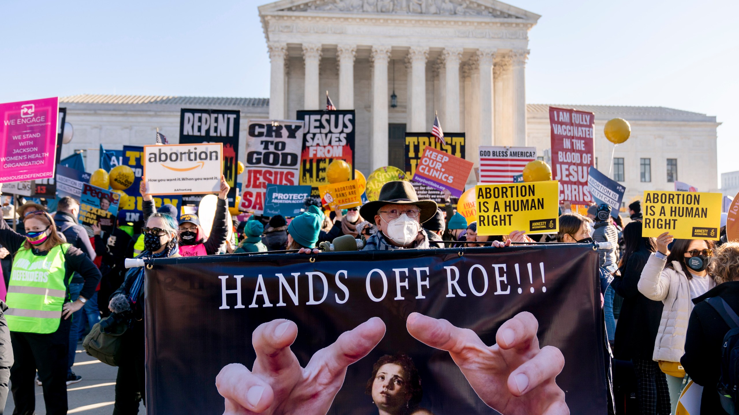 FILE - Abortion rights advocates and anti-abortion protesters demonstrate in front of the U.S. Supreme Court, Dec. 1, 2021, in Washington. There's action on abortion policy in rulings, legislatures, and campaigns for candidates and ballot measures on the 51st anniversary of Roe v. Wade. The 1973 ruling established the right to abortion across the U.S. But things have been in flux since the U.S. Supreme Court overturned it in 2022. (AP Photo/Andrew Harnik, File)